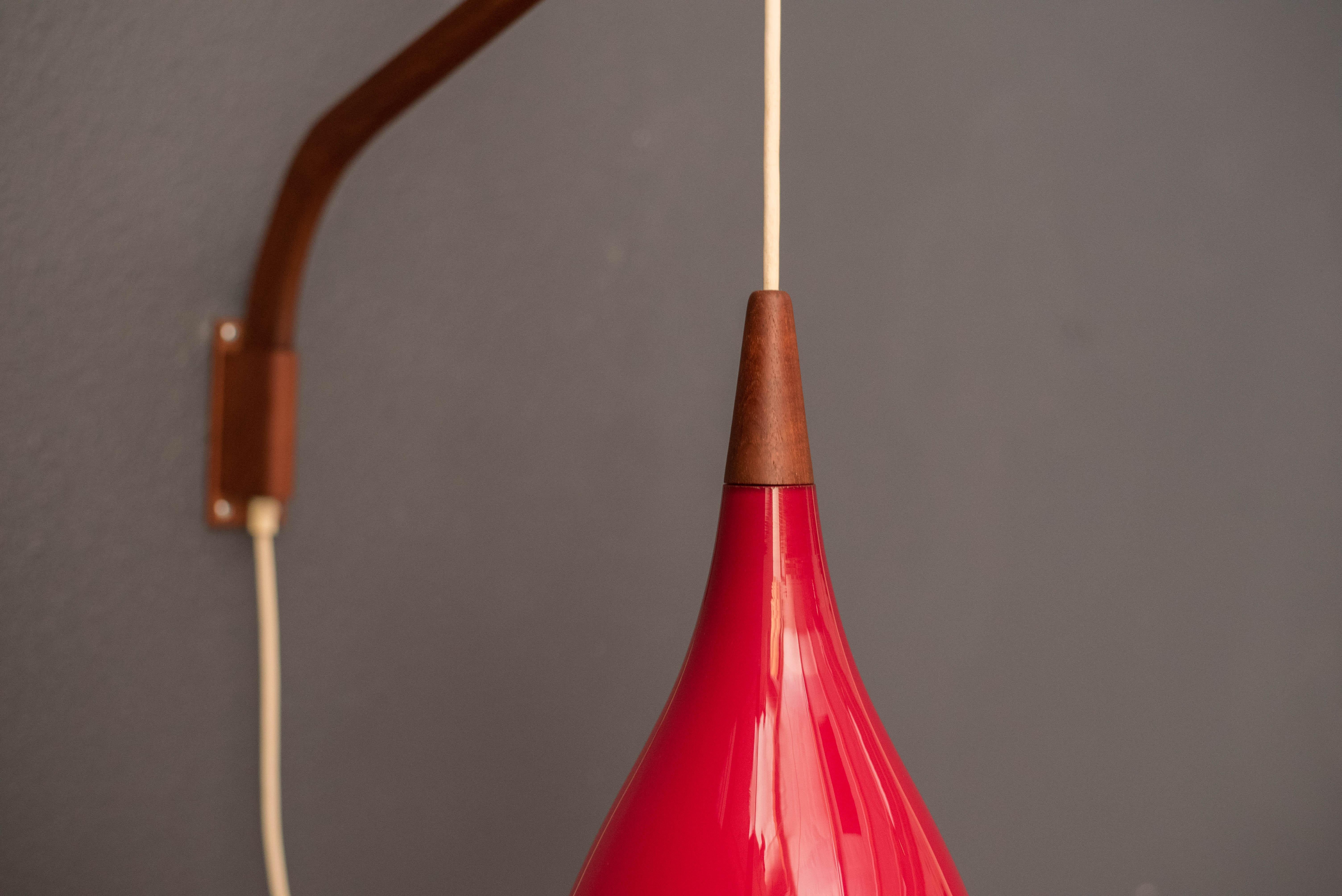 Scandinavian Modern Danish Teak Swing Arm Red Glass Pendant Lamp by Holmegaard