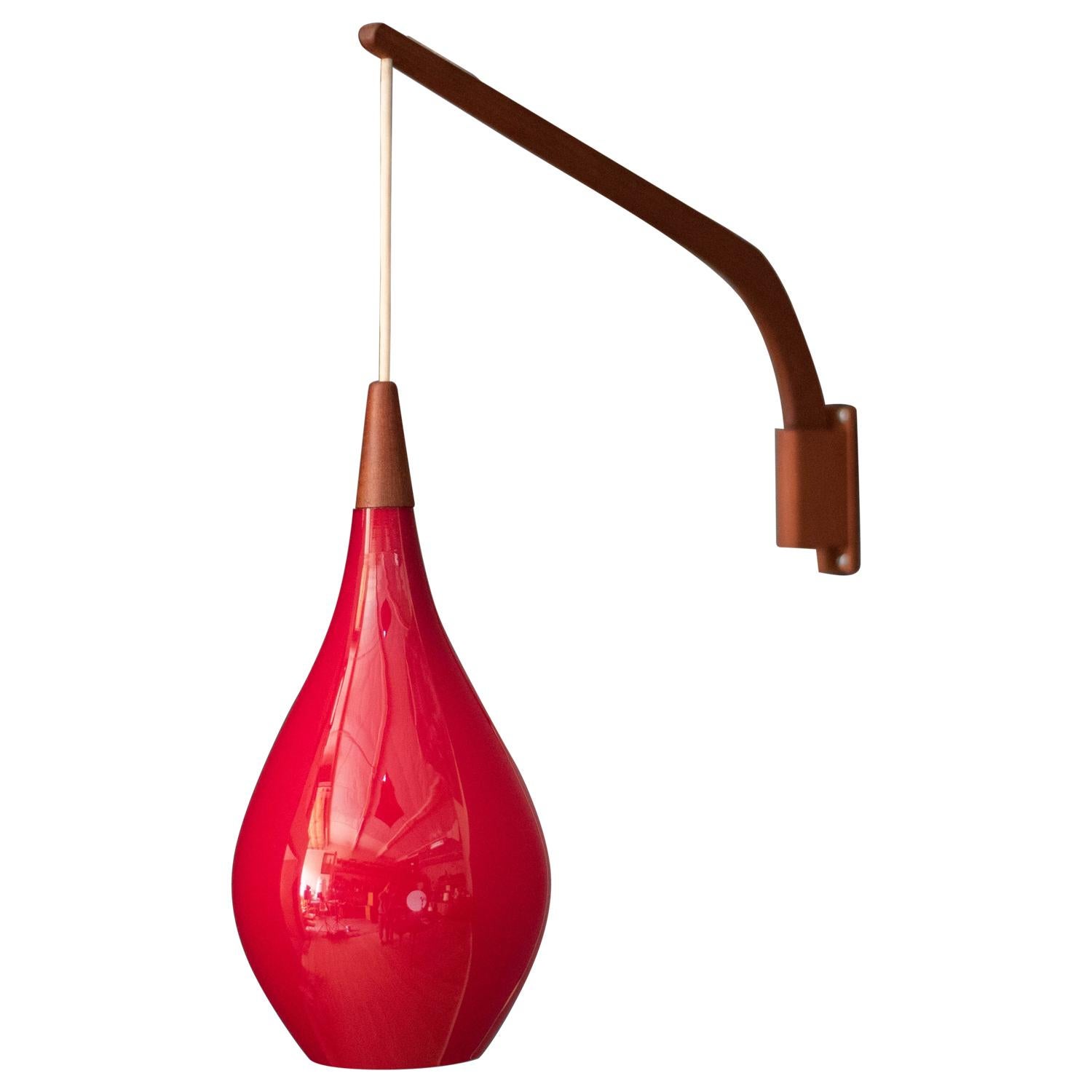 Danish Teak Swing Arm Red Glass Pendant Lamp by Holmegaard