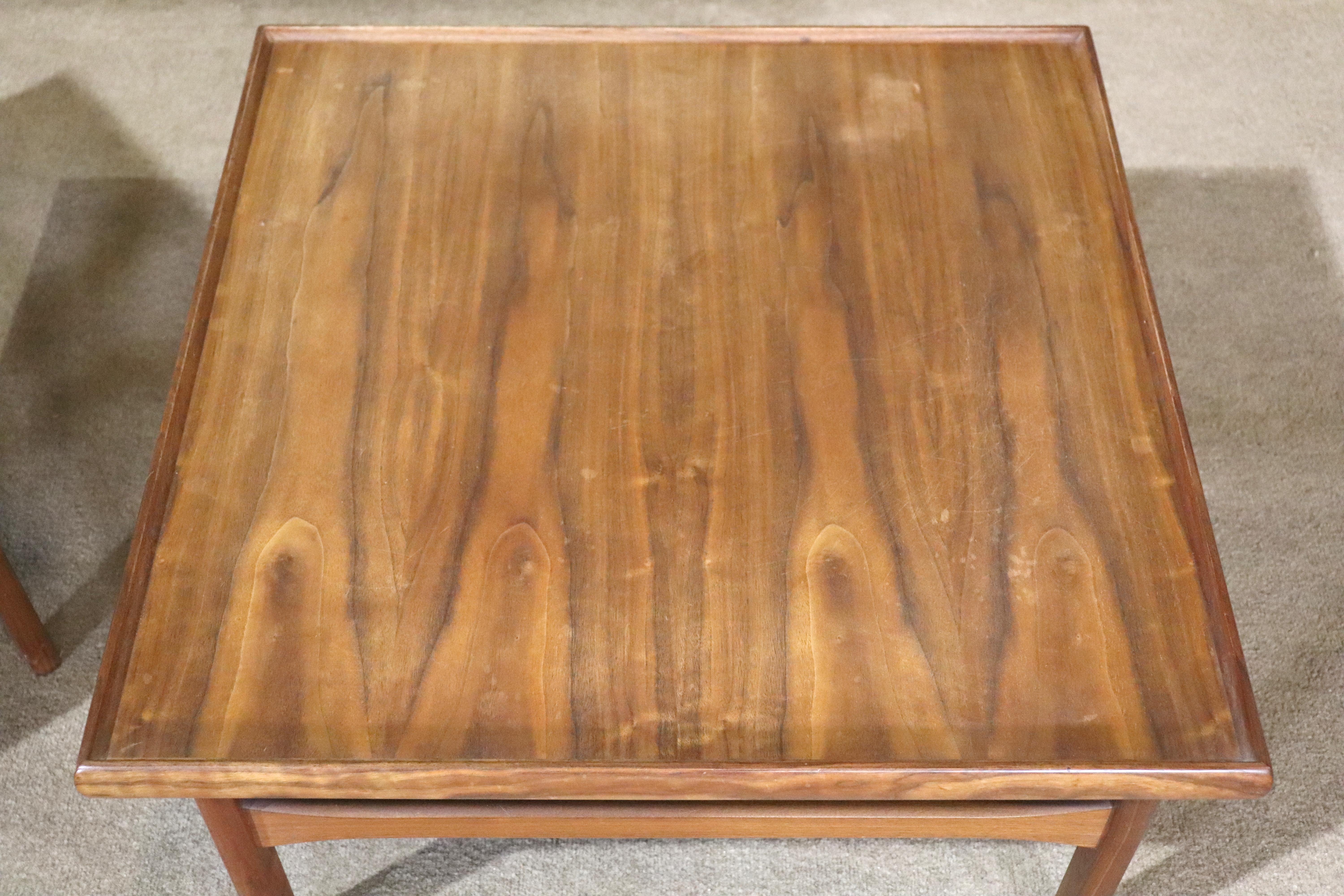 Square teak table by Moreddi. Simple Danish design with turned edges and wood stretchers.
Please confirm location NY or NJ