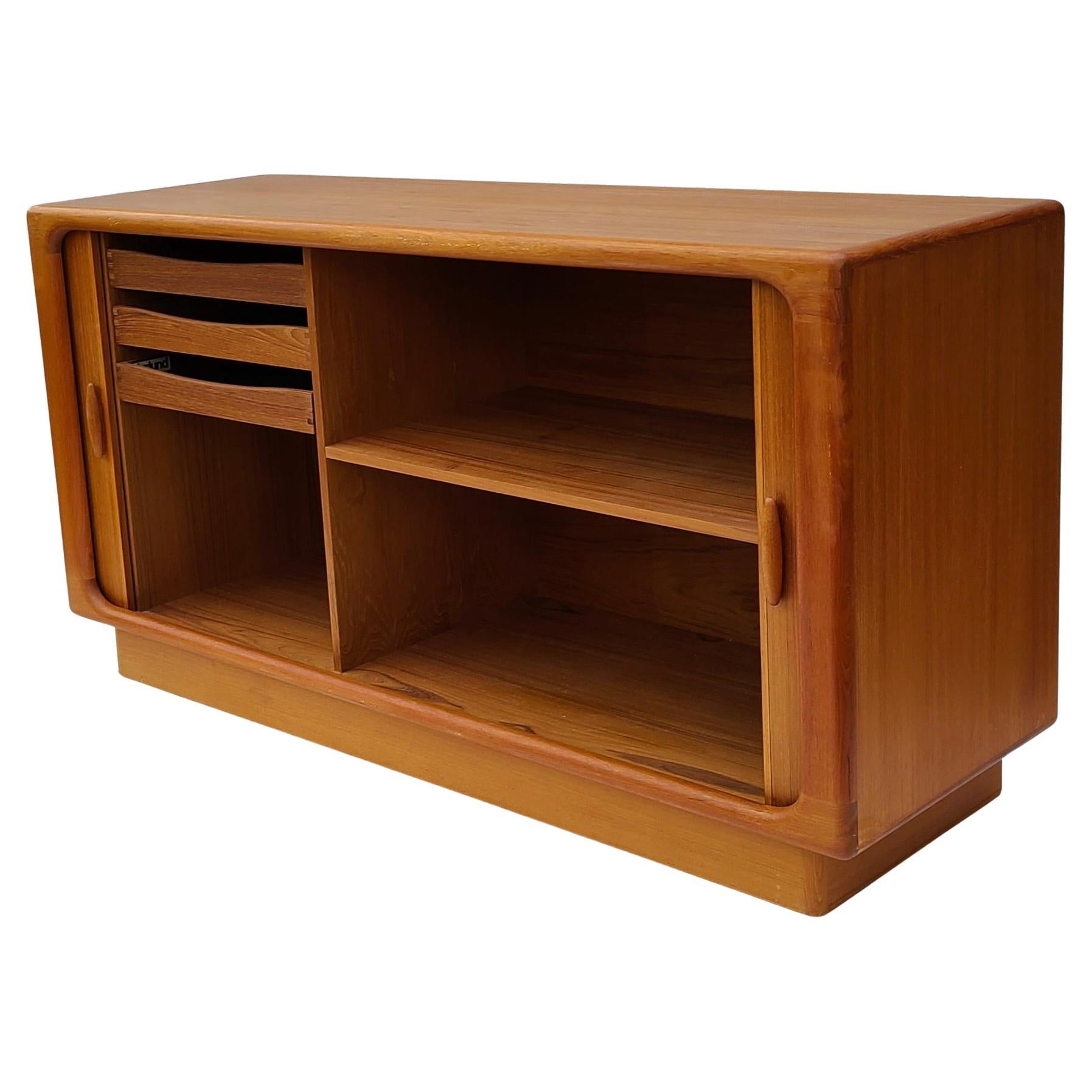 Please feel free to reach out for efficient shipping quote to your location.

Teak Tambour Sliding Door Cabinet.
Made in Denmark by Dyrlund.
