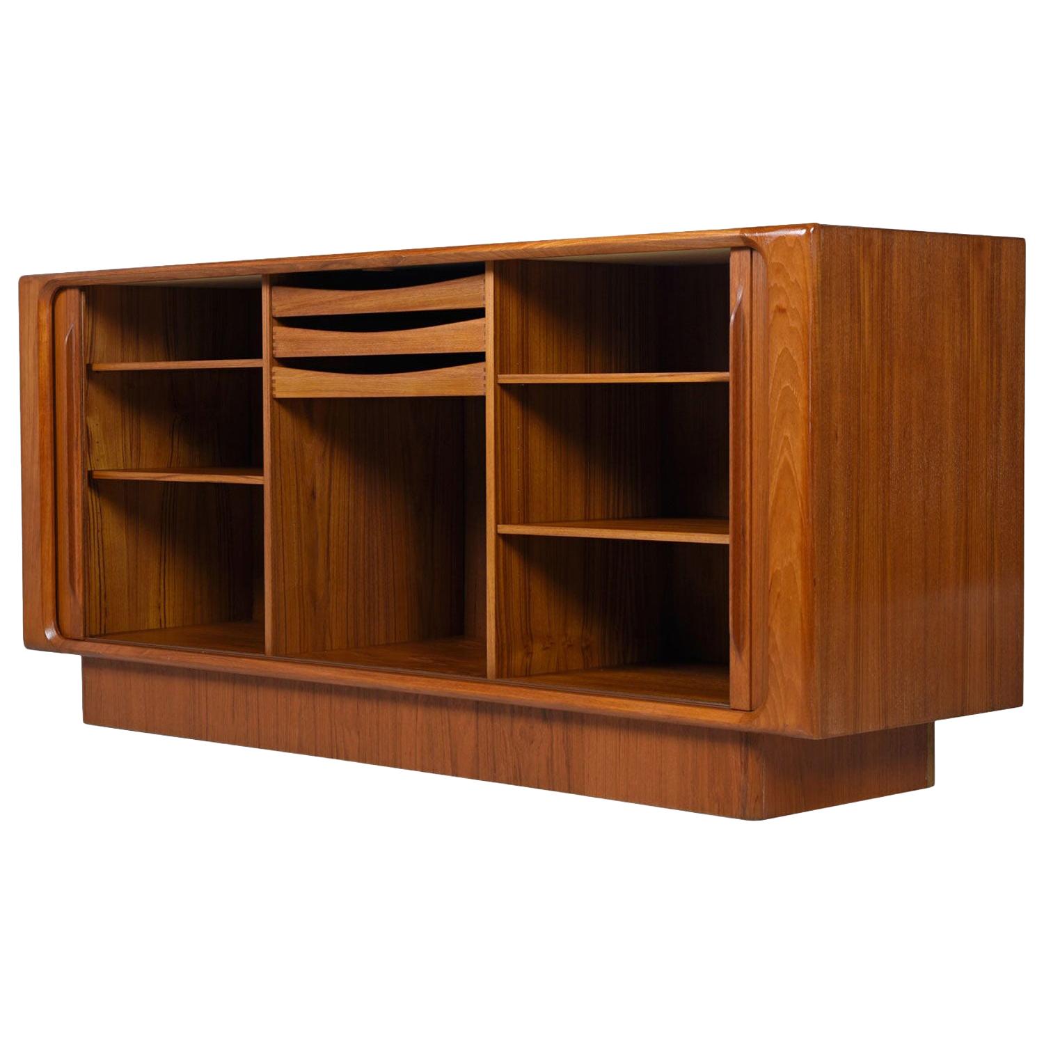 Exquisitely crafted vintage Danish teak chest by Bernhard Pedersen and Son. The back side is fully finished, ideal for open floor plans. This is the perfect media center. The large cabinet spaces provide amble room for 12? LP records and components.