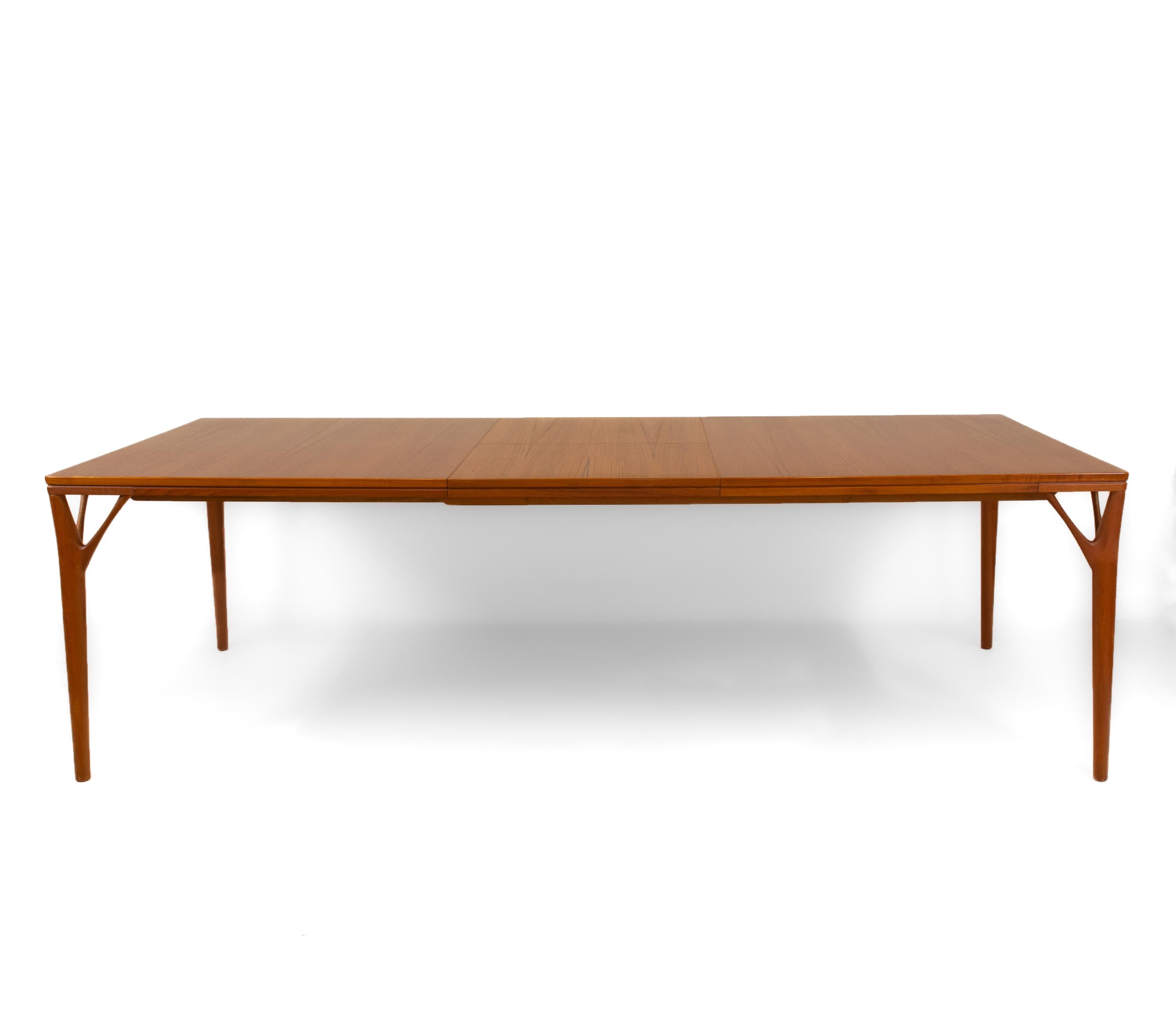 A beautiful mid century Danish ‘Tree Leg’ teak extending dining table by H Sigh & Sons. Maker's label, 'H. Sign & Sons Denmark'. Signed in pencil 'Table No 35'. Circa 1960.

Delivery is INCLUDED in the price for all areas in MAINLAND England &