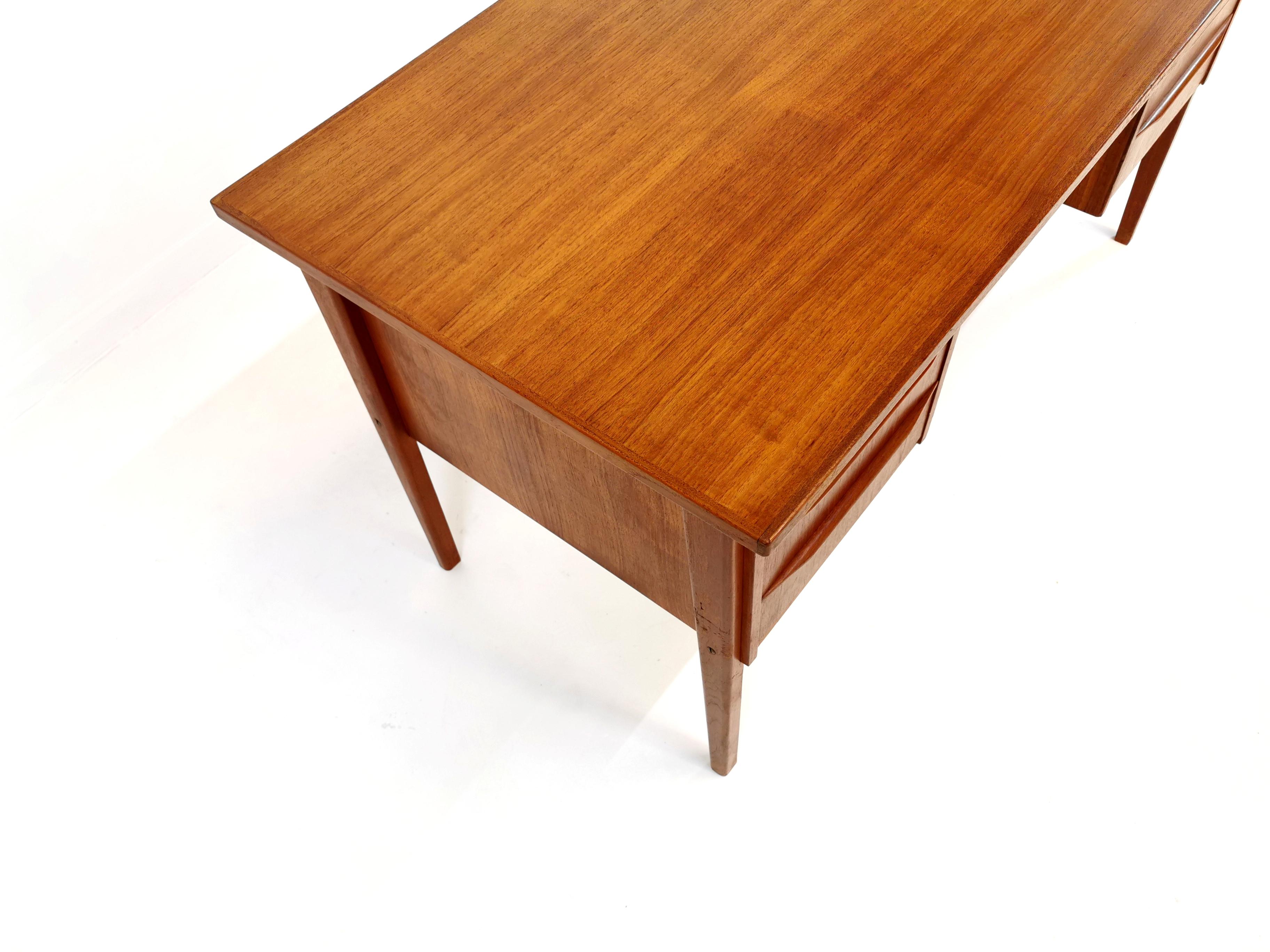 A very stylish Danish desk from the 1960s.

Twin pedestal. Very sleek and minimal design.

Also has a finished back so it can be placed in the centre of a room.