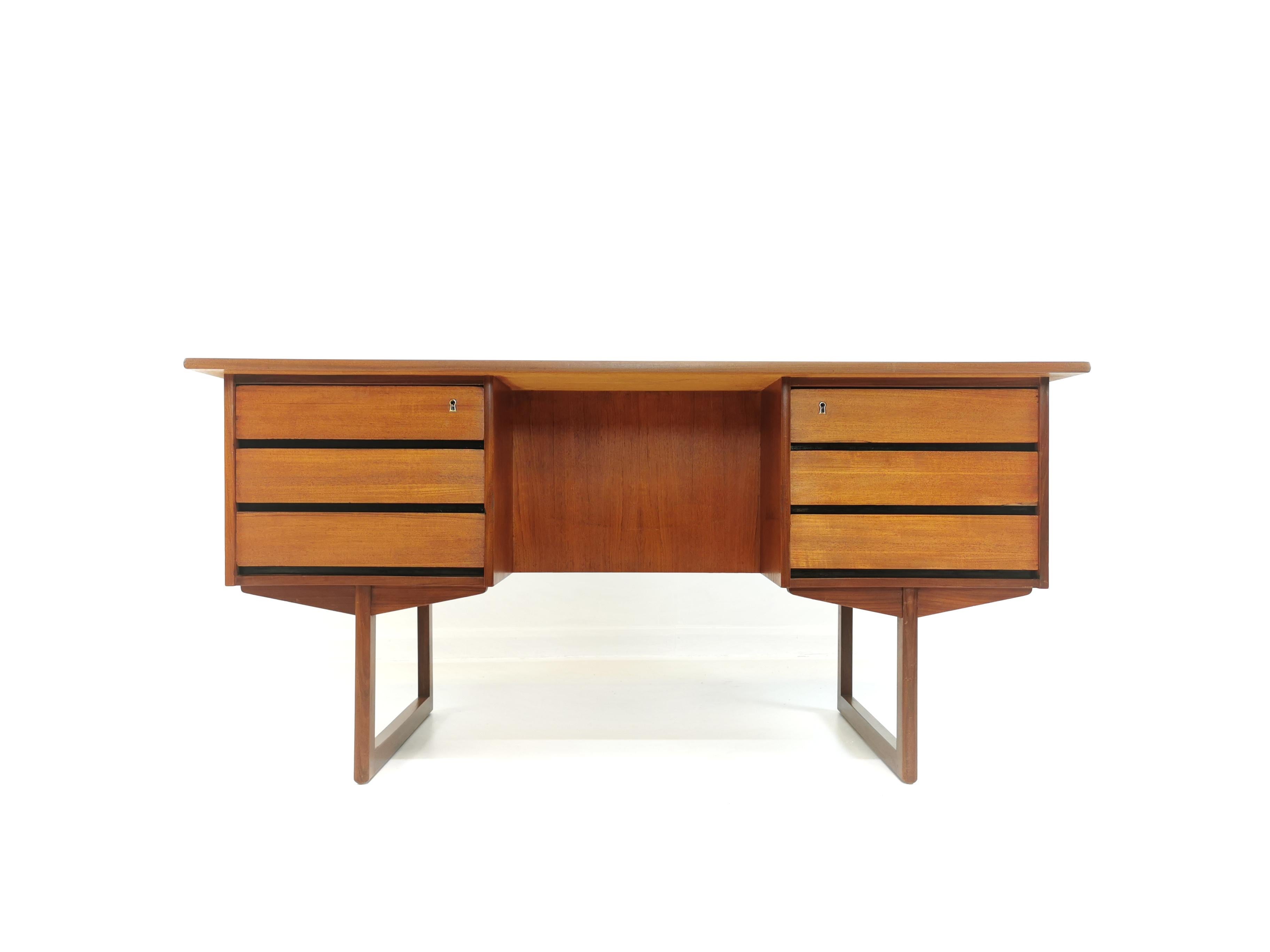 A very stylish Danish desk from the 1960s.

Twin pedestal. Very sleek and minimal design.

Also has a finished back so it can be placed in the centre of a room.