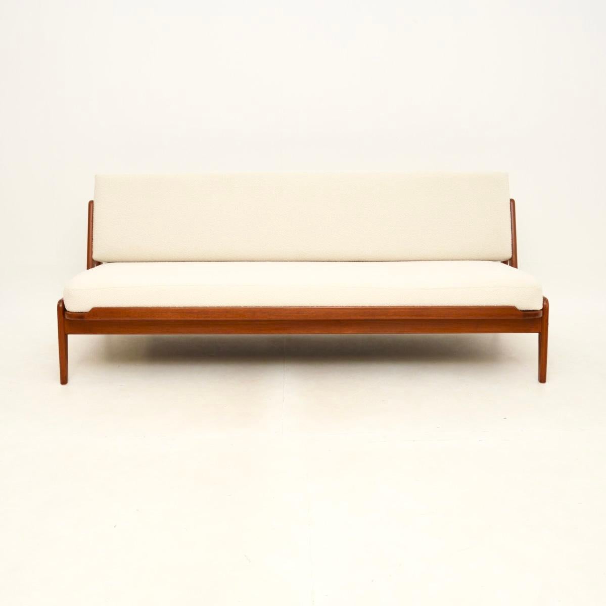 A beautiful and rare Danish teak vintage sofa bed by Arne Wahl Iversen. This was made in Denmark by Komfort, it dates from the 1960’s.

The quality is fantastic, this has a very stylish and clever design. The seat pulls forward to increase the depth