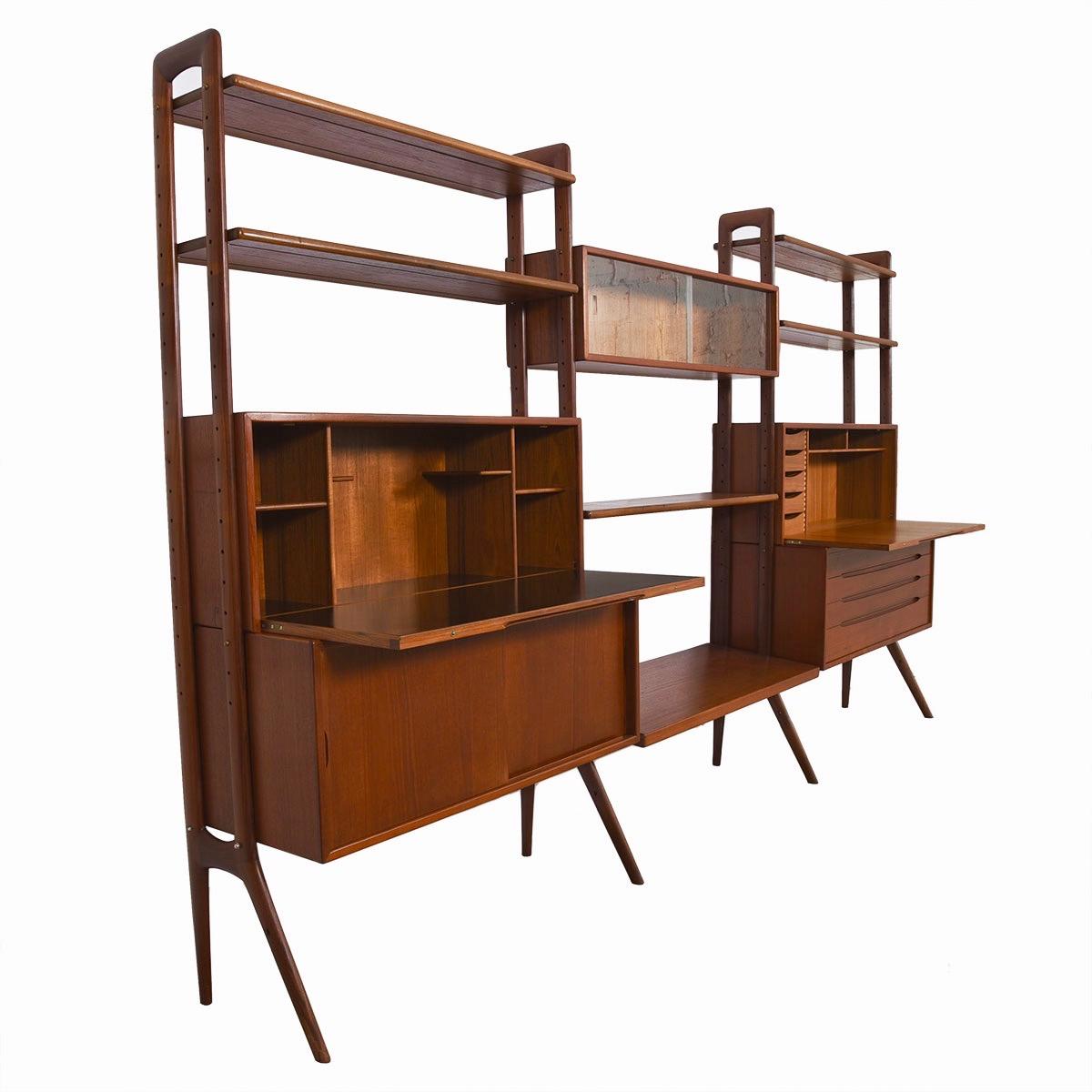 - The statement piece that will define your space yet also help to contain, organize and curate your stuff.
- Finished on the back for placement in the middle of a room.
- Use the drop-down surface on either side as a workstation or a bar.
-