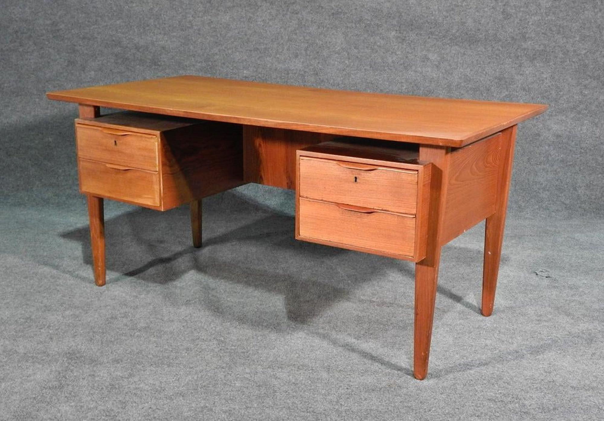 Mid-Century Modern Danish writing desk with finished storage back.
(Please confirm item location - NY or NJ - with dealer).
 