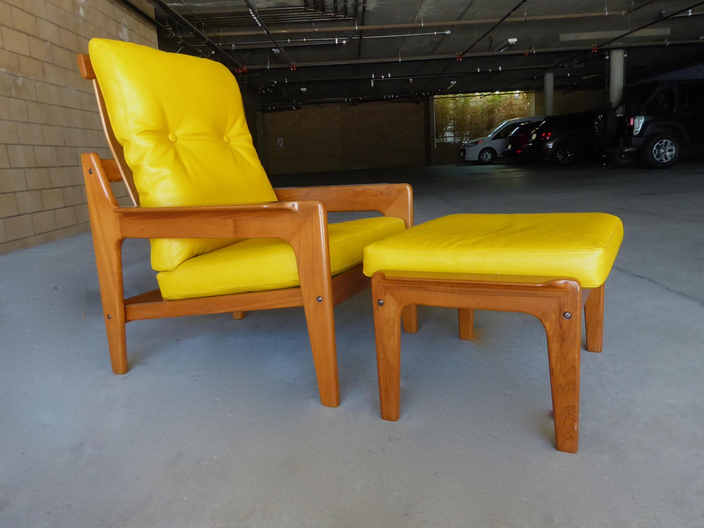 A Danish teakwood armchair and ottoman designed in the 1960s by Arne Wahl Iversen for Komfort Furniture. The set has been newly polished and reupholstered in a fine quality yellow leather. The Komfort label appears below the chair seat.
The