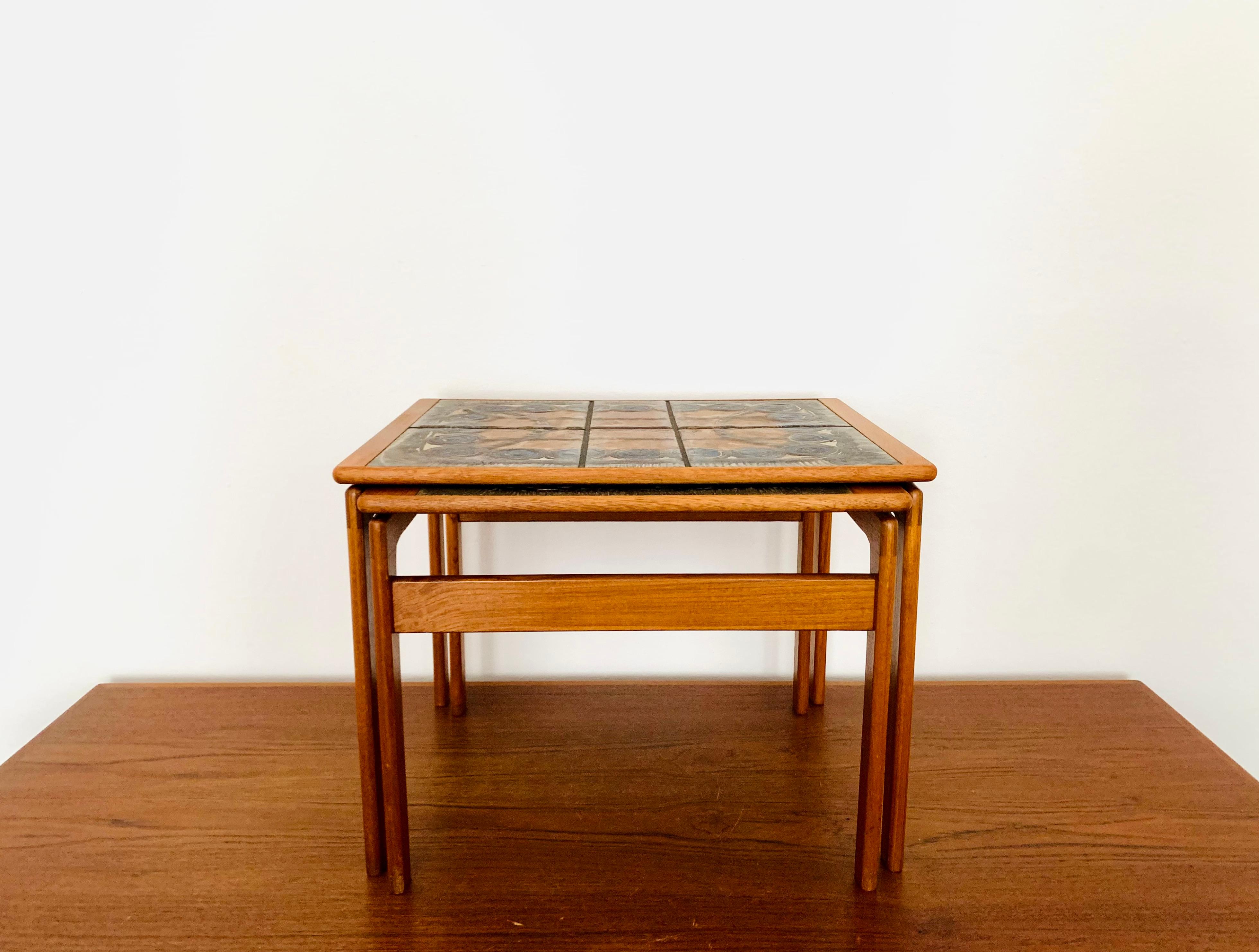 Extremely beautiful Danish teak tables with ceramic inlays from the 1960s.
Wonderful and high quality design.
An enrichment for every home.
The hand-painted and very decorative tiles are special.

Design: Ox Art
Manufacturer: