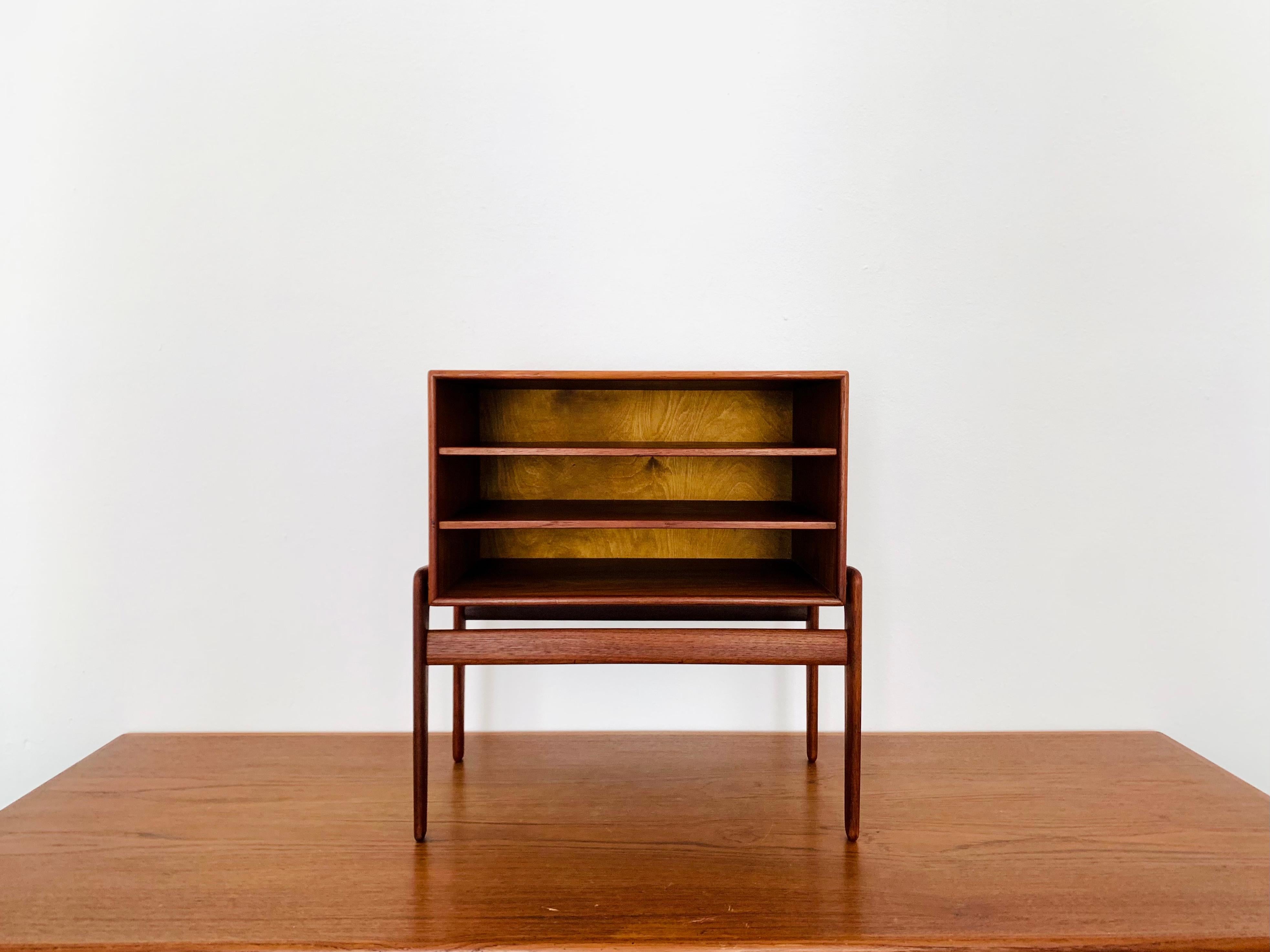 Exceptionally beautiful Danish teak bedside table from the 1960s.
The high-quality workmanship and the elegant design make the small piece of furniture a real favourite.
Another use is of course also possible because the piece of furniture fits