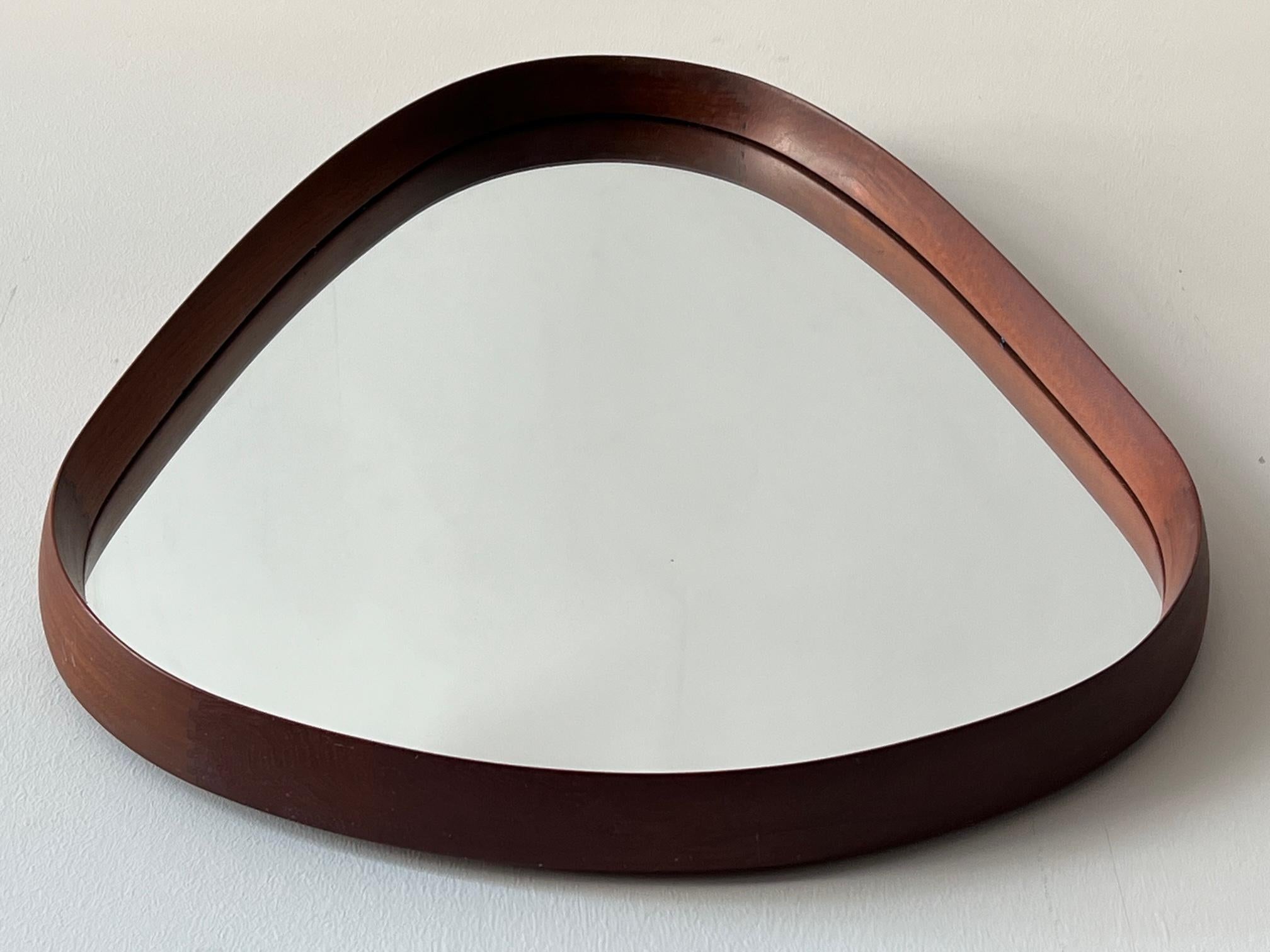 An unusual Danish teak tear drop shape mirror. Nicely finger joined and sculptural look. Could be hung either way.