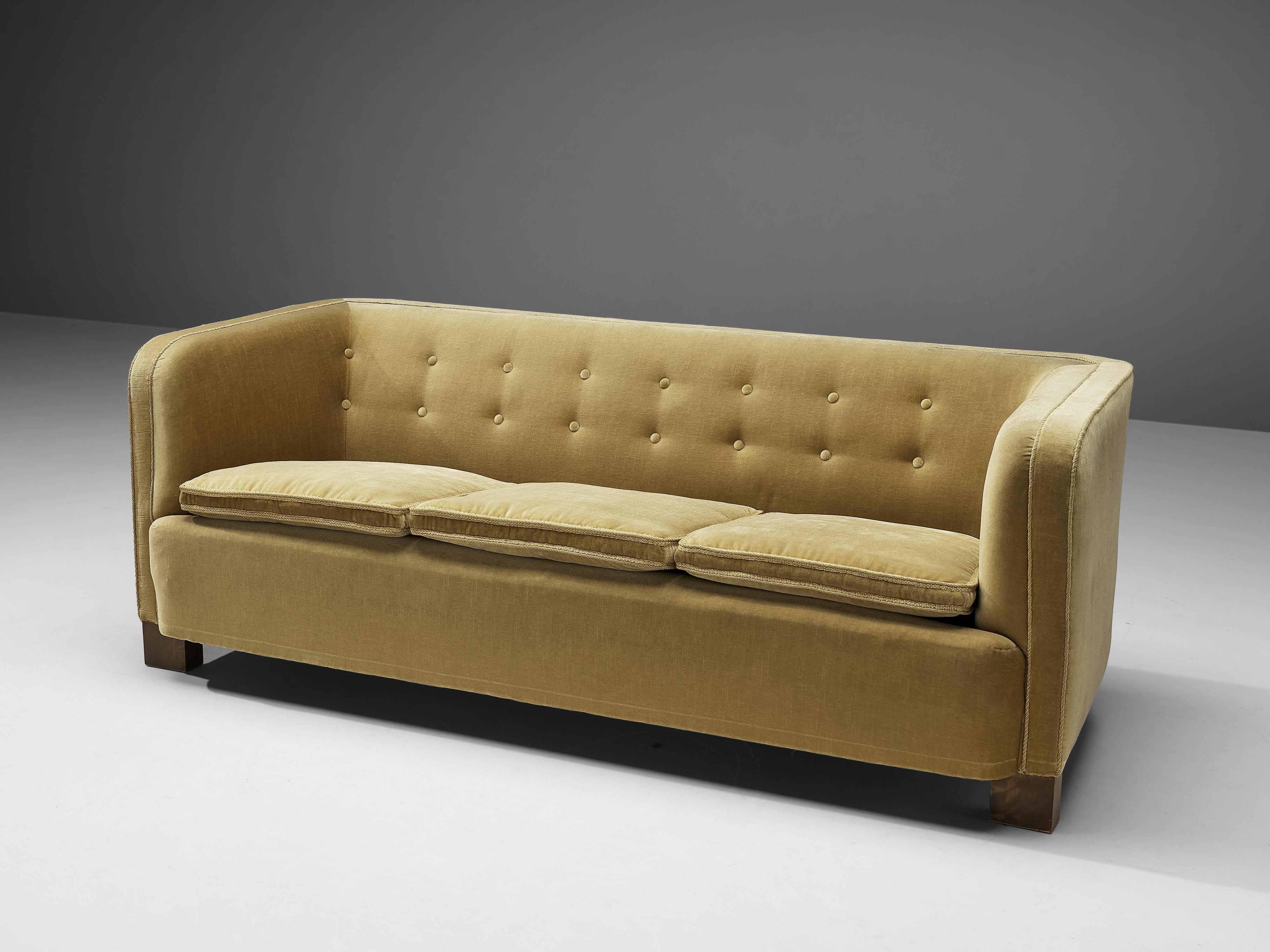 Three-seat sofa, velvet and wood, Denmark, 1930s

This comfortable sofa has a sturdy appearance, with elegant armrests. This graceful look is emphasized by the decorative cushions and the sleek overall look. The sofa is supported by wooden feet