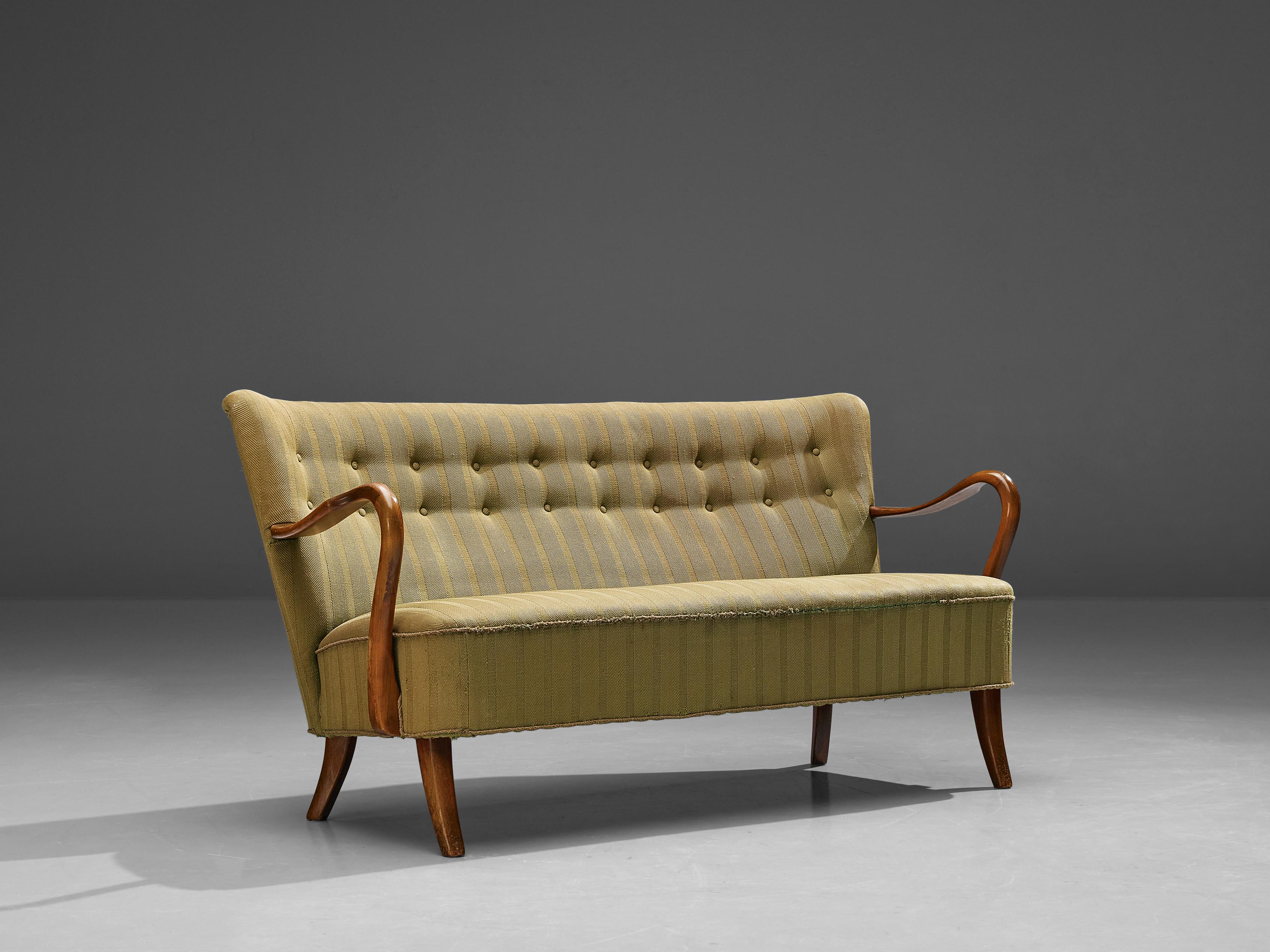 Three seater sofa, beech, fabric, Denmark, 1950s

This sofa is pure and clean in its appearance due to its lack of unnecessary decoration. In the meantime, the slightly long shaped backrest and the sleek legs, executed in beech, create a very