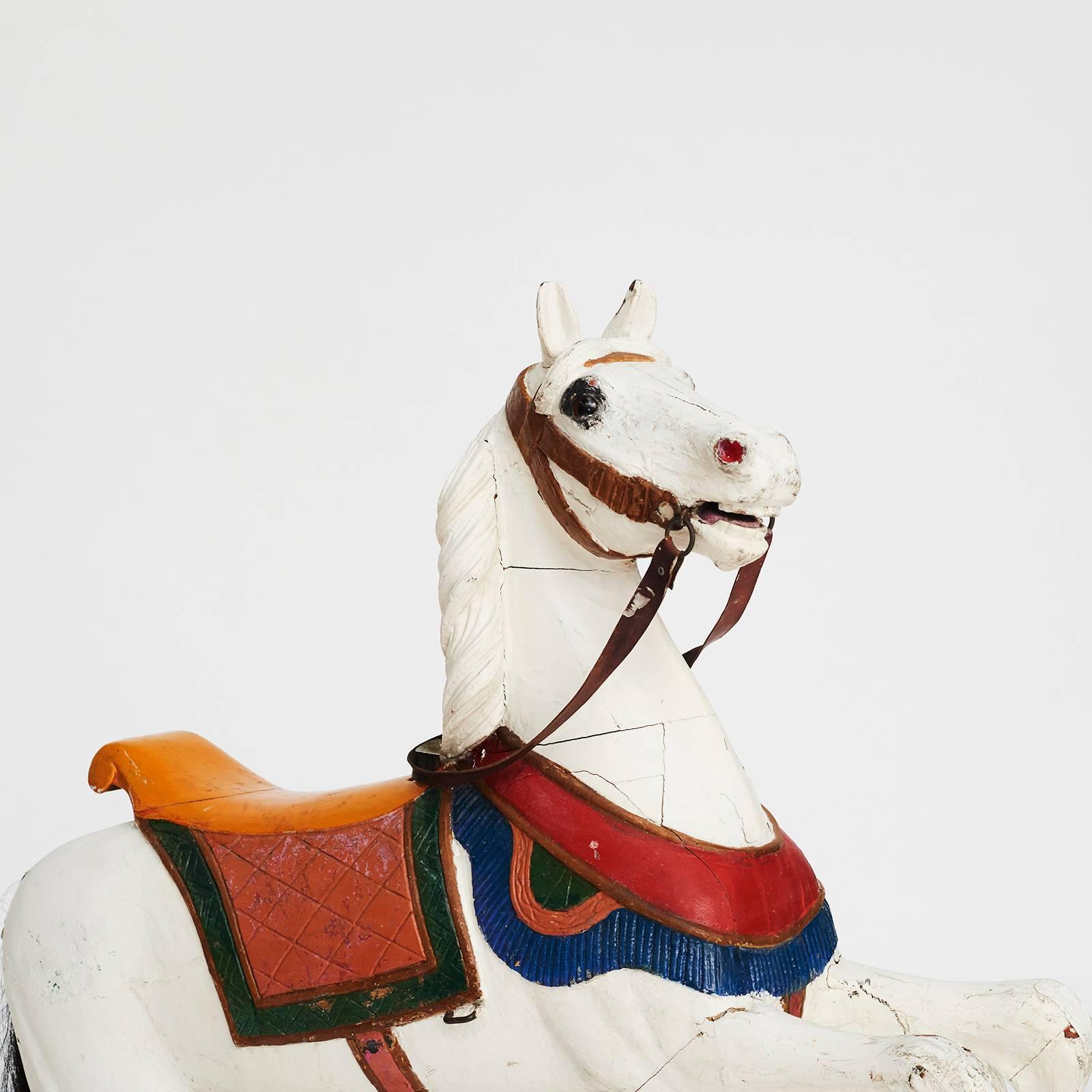 A large carved and painted, leather and horse hair, carousel horse, mid-19th century. This horse was originally made in Germany where the finest amusement park pieces were produced at the time. It was made as a special order for the opening of the