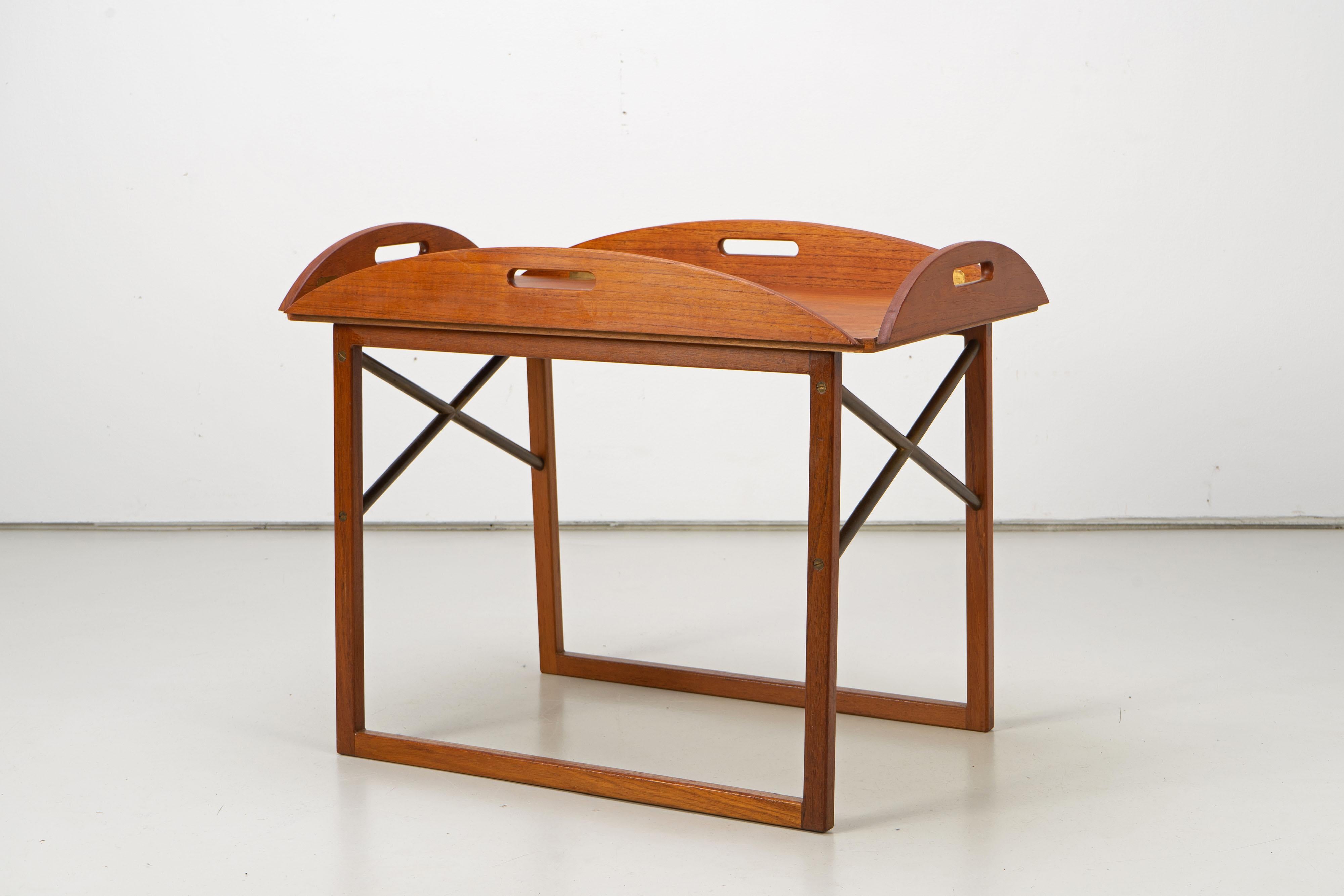 Danish Modern side table by Svend Langkilde. This table features a removable top with folding edges, so it can be used as a tray.
