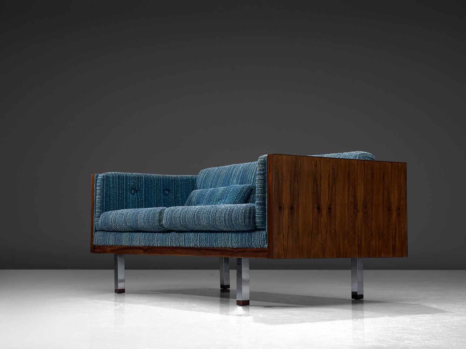 Jydsk Mobelvaerk, living room set, rosewood and blue upholstery, Denmark, 1960s. 

This living room set by Jydsk Mobelvaerk is made with rosewood sides doesn't go unnoticed, as it attracts attention due to it's blue upholstery. The rosewood frame