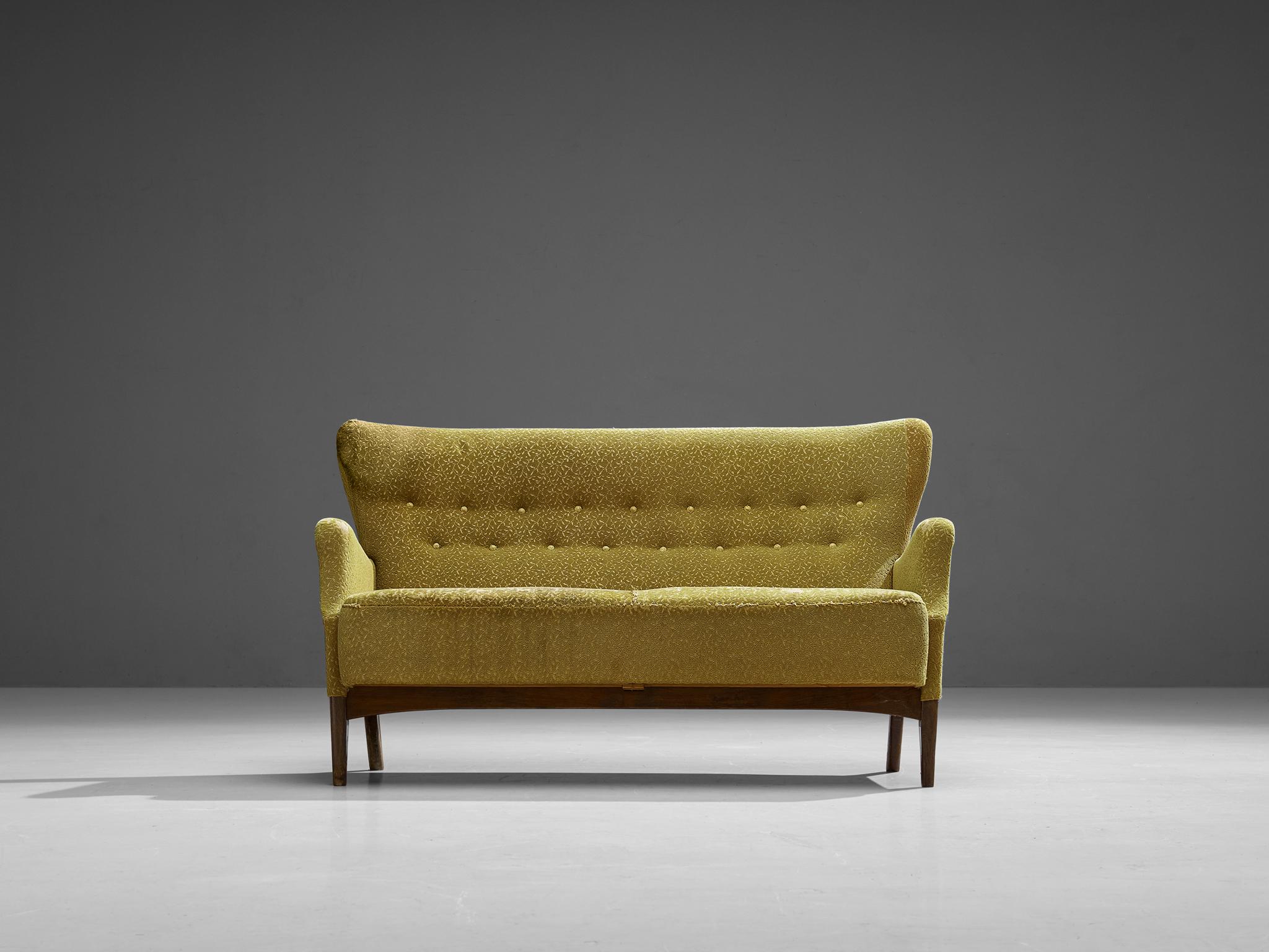 Sofa, fabric, stained wood, Denmark, 1940s.

This Danish sofa shows elegant curves and beautiful lines, especially on the folded armrests. The tufted back with buttons contributes to the classical Scandinavian style, and strongly resembles the style