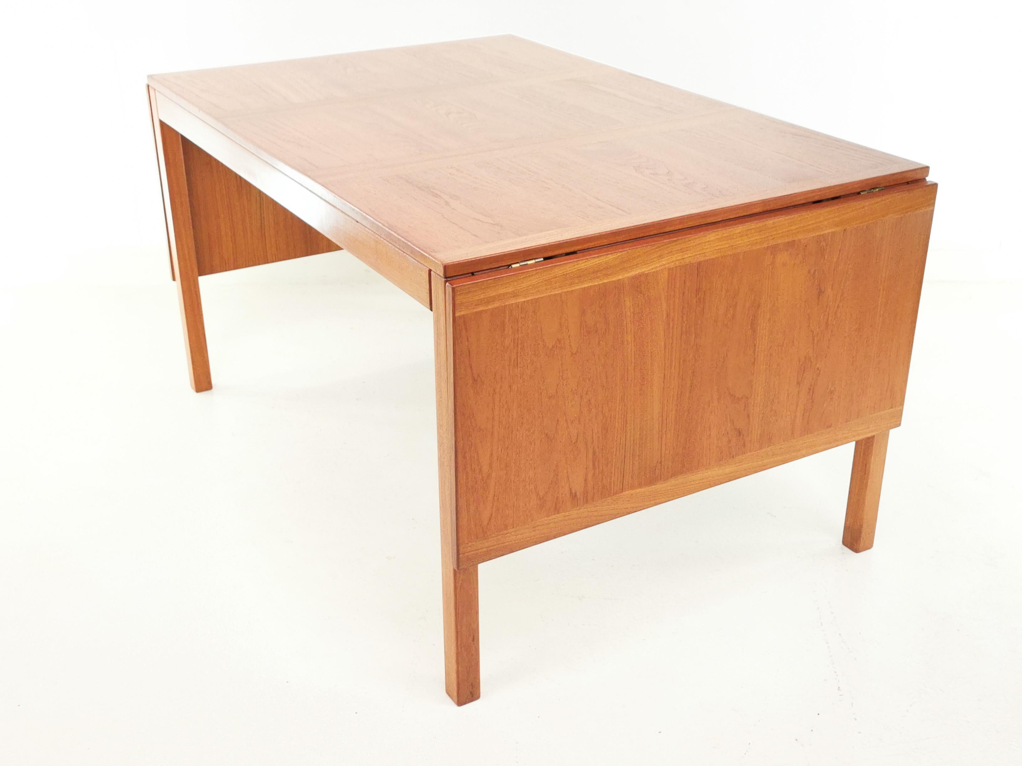 Danish teak extending dining table

Vejle Stole Mobelfabrik of Denmark 1970s dining table.

This mid-century modern teak drop leaf dining table has two removable leaves and can seat 8-10 people at its maximum size.

Made from teak. A sleek
