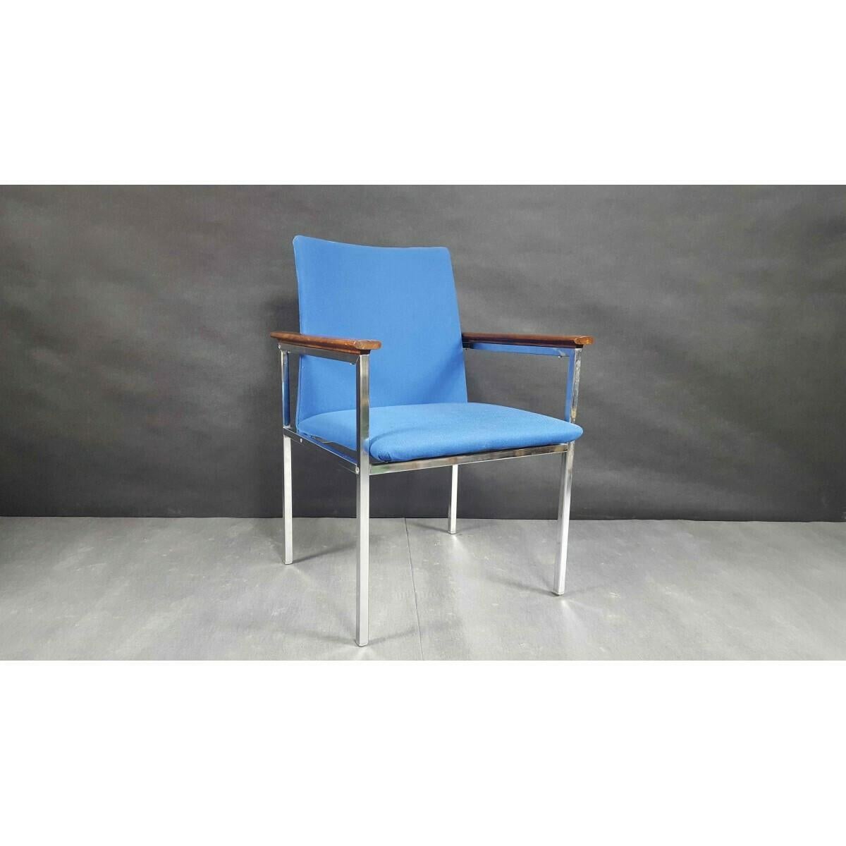 Scandinavian Mid-Century Modern armchair. 
Designed by renowned Swedish designer Sigvard Bernadotte and produced by Danish manufacturer France & Son.
A chromed steel frame with wooden armrests.
Armchair will be unfolded fot the shipping.