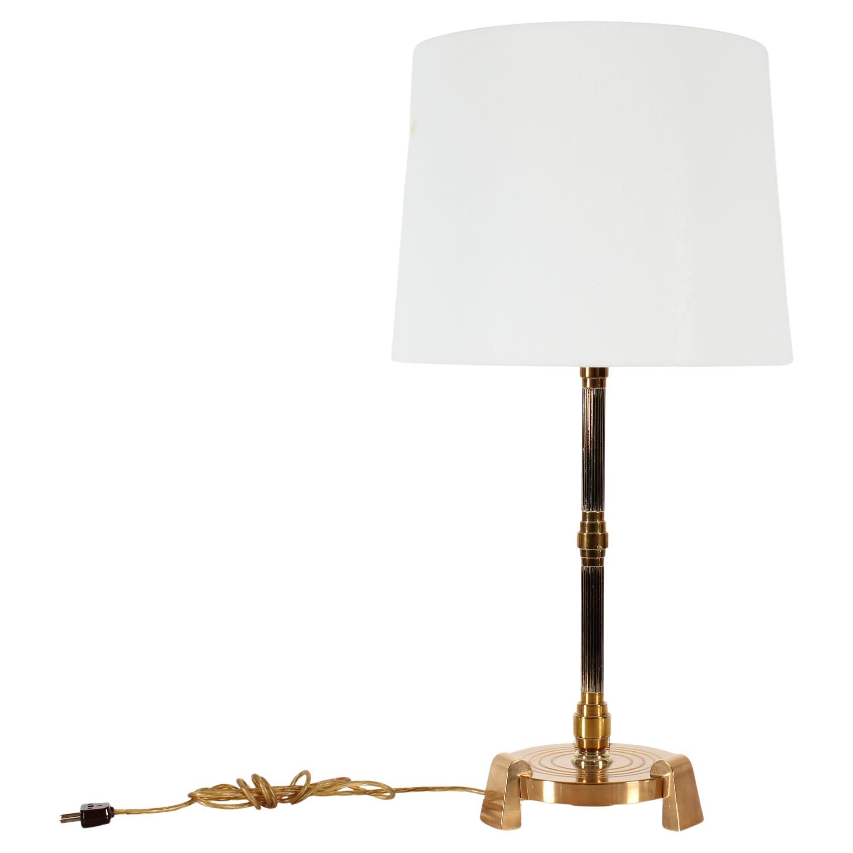 Vintage Bindesbøll style high desk lamp made of an alloy of copper and other metals like bronze and brass (ore). The special alloy has a deep golden brown color 
The stem has two fluted sections and the base is placed on three strong feet.

Height