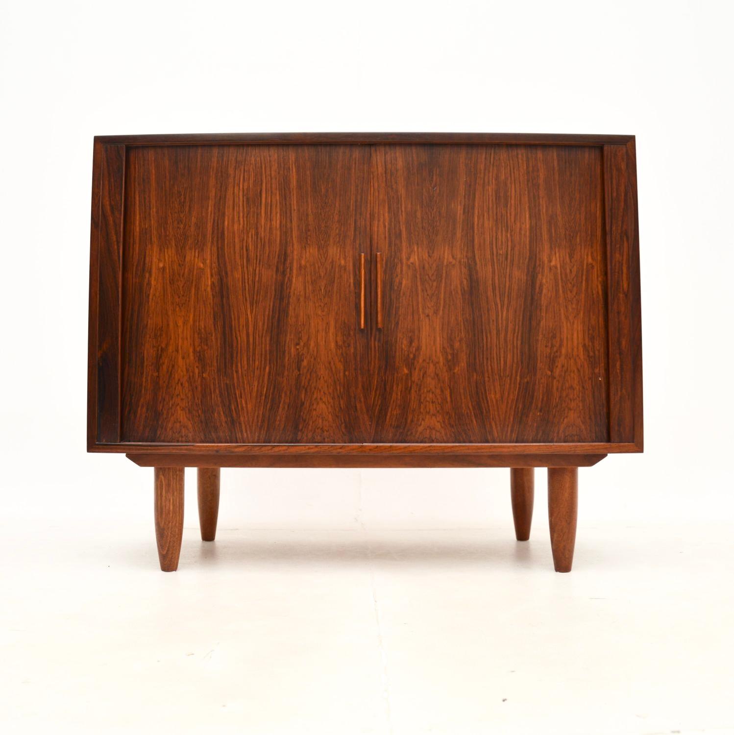 A gorgeous Danish vintage cabinet by Kai Kristiansen, made in Denmark in the 1960’s.

It is of superb quality, with a very stylish and practical design. The colour and grain patterns are beautiful, this looks amazing from all angles. It has