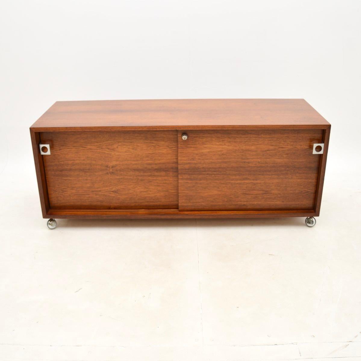 A stunning and extremely rare Danish vintage cabinet / sideboard by Bodil Kjaer. This was designed in 1959 as part of a whole office range, this piece dates from the 1960’s. It was made in Denmark by E. Pedersen & Søn.

The quality is outstanding,