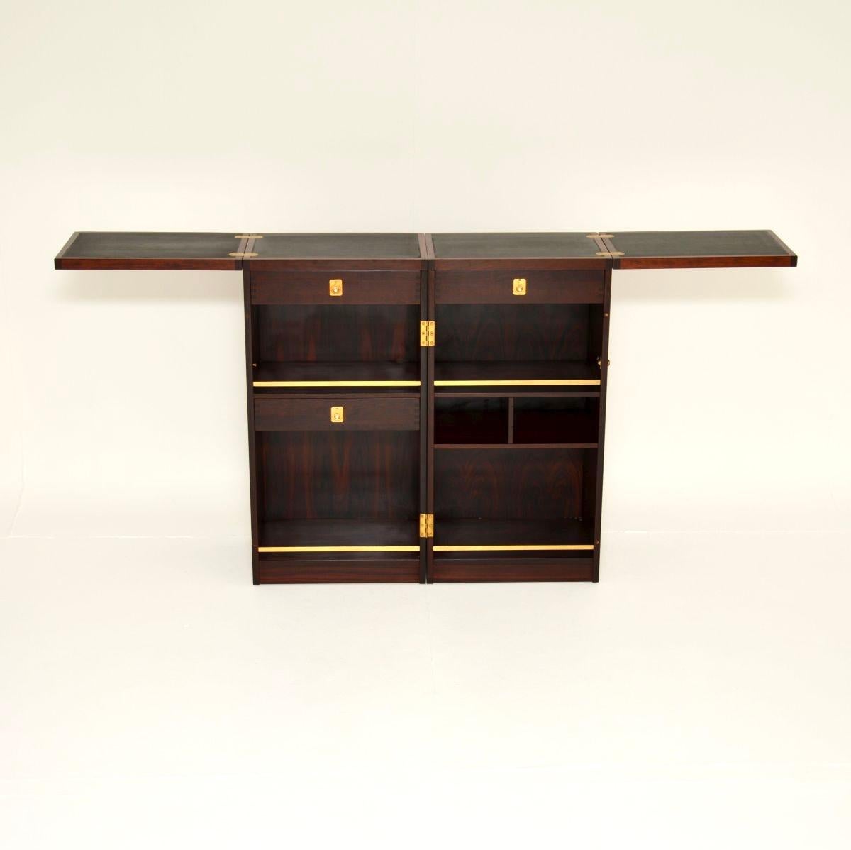 An absolutely stunning Danish vintage captains bar by Reno Wahl Iversen for Dyrlund. It was made in Denmark and dates from the 1960’s.

This is of amazing quality, it has an incredibly stylish and practical design. It unfolds from a simple box