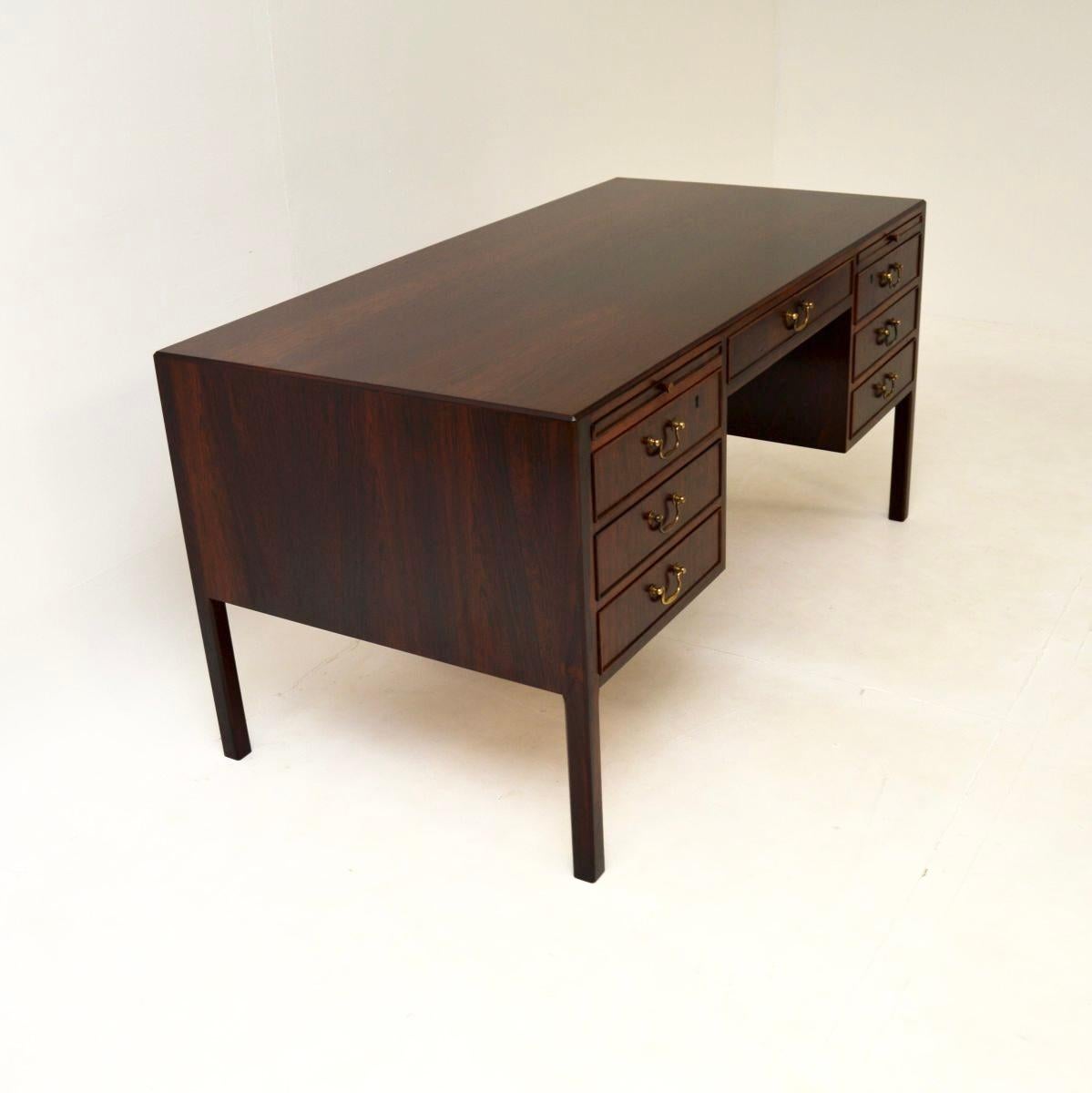 A stylish and extremely well made Danish vintage desk by O. Bank Larsen Mobelfabrik. It was made in Denmark, it dates from around the 1950’s.

It is of outstanding quality, it is a great size with a generous working space and large kneehole. The