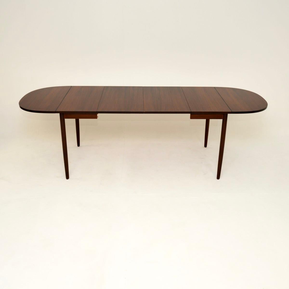 A stunning and rare Danish vintage dining table by Arne Vodder. This is the model 227 table, it was made in Denmark and dates from the 1960’s.

It is very well made, the quality is superb. This has nice grain patterns and a lovely colour tone