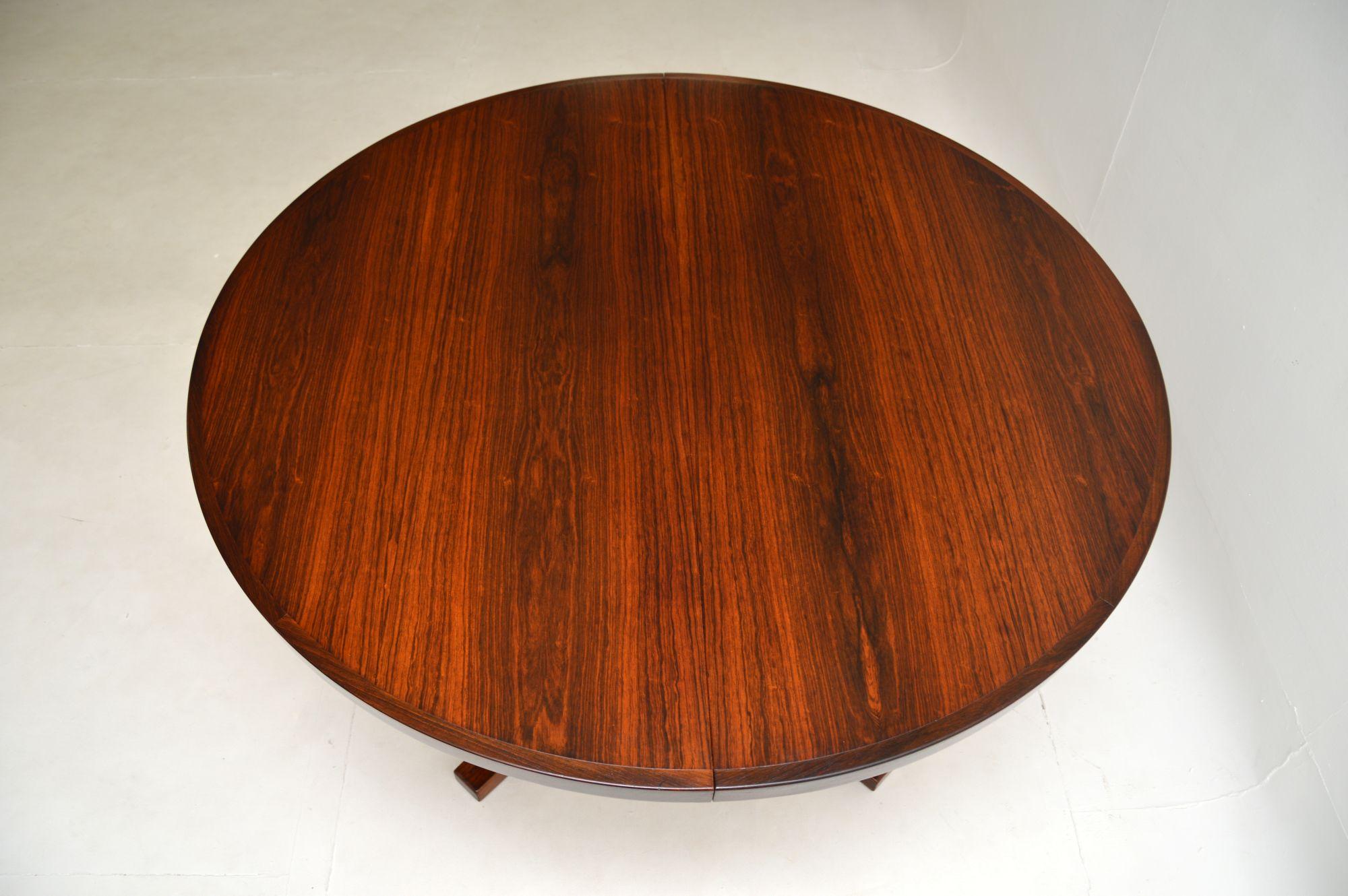 A stylish and extremely well made Danish vintage dining table by John Mortensen, dating from the 1960’s.

This is of exceptional quality, the large round circular top can seat six comfortably. This is an extending table that comes with two leaves,