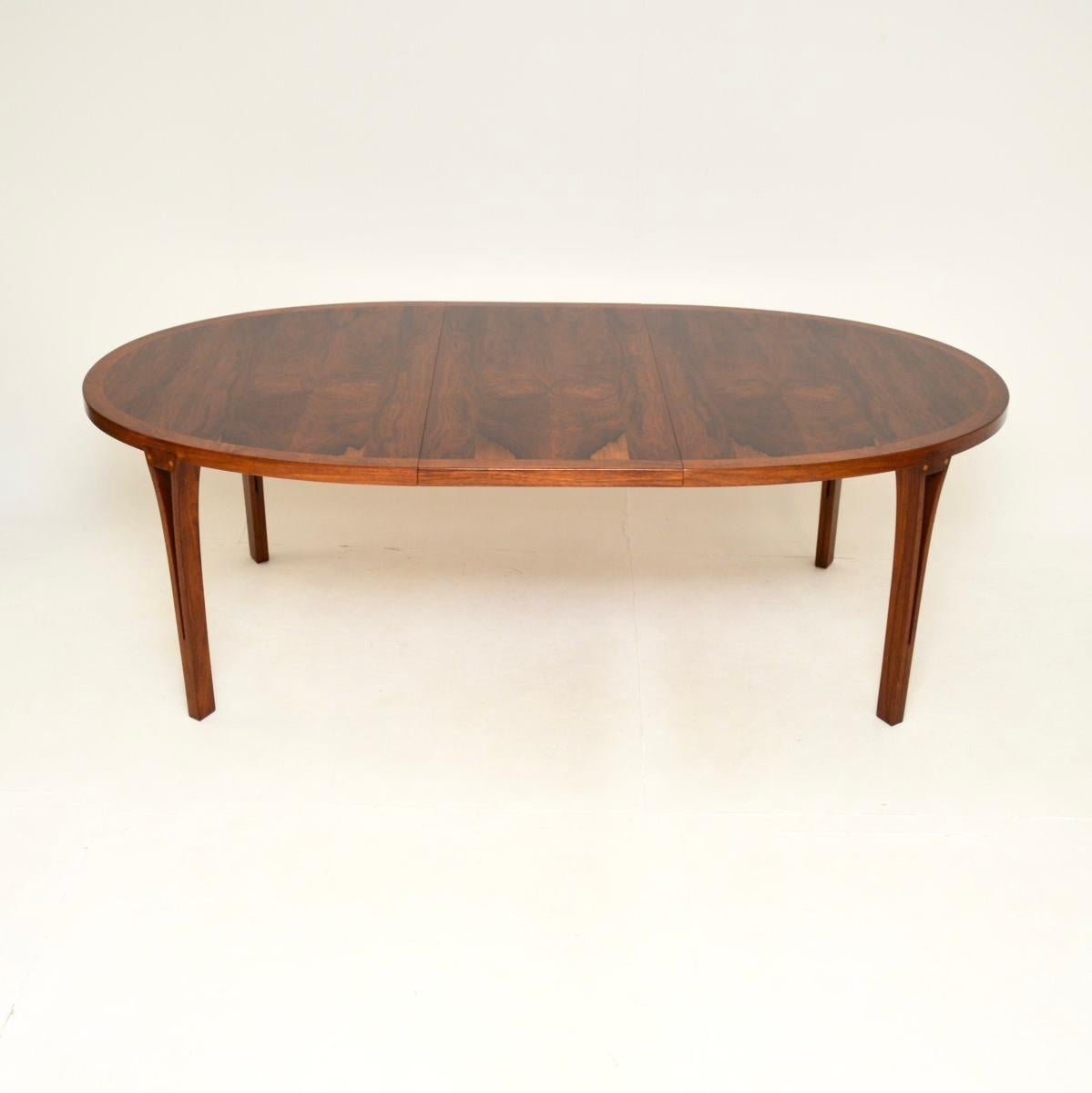 A stunning and extremely rare Danish vintage dining table by Sven Ellekaer. This was made in Denmark by Heltborg Mobler, it dates from the 1960’s.

The oval top has gorgeous grain patterns and colour tones, with a beautifully cross banded edge. It