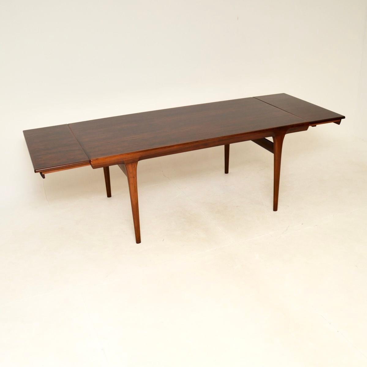 An absolutely stunning Danish vintage extending dining table by IB Kofod Larsen. It was made in Denmark by Faarup, it dates from the 1960’s.

The quality is outstanding, it stand on stylish tapered legs and has a beautifully moulded top edge. There