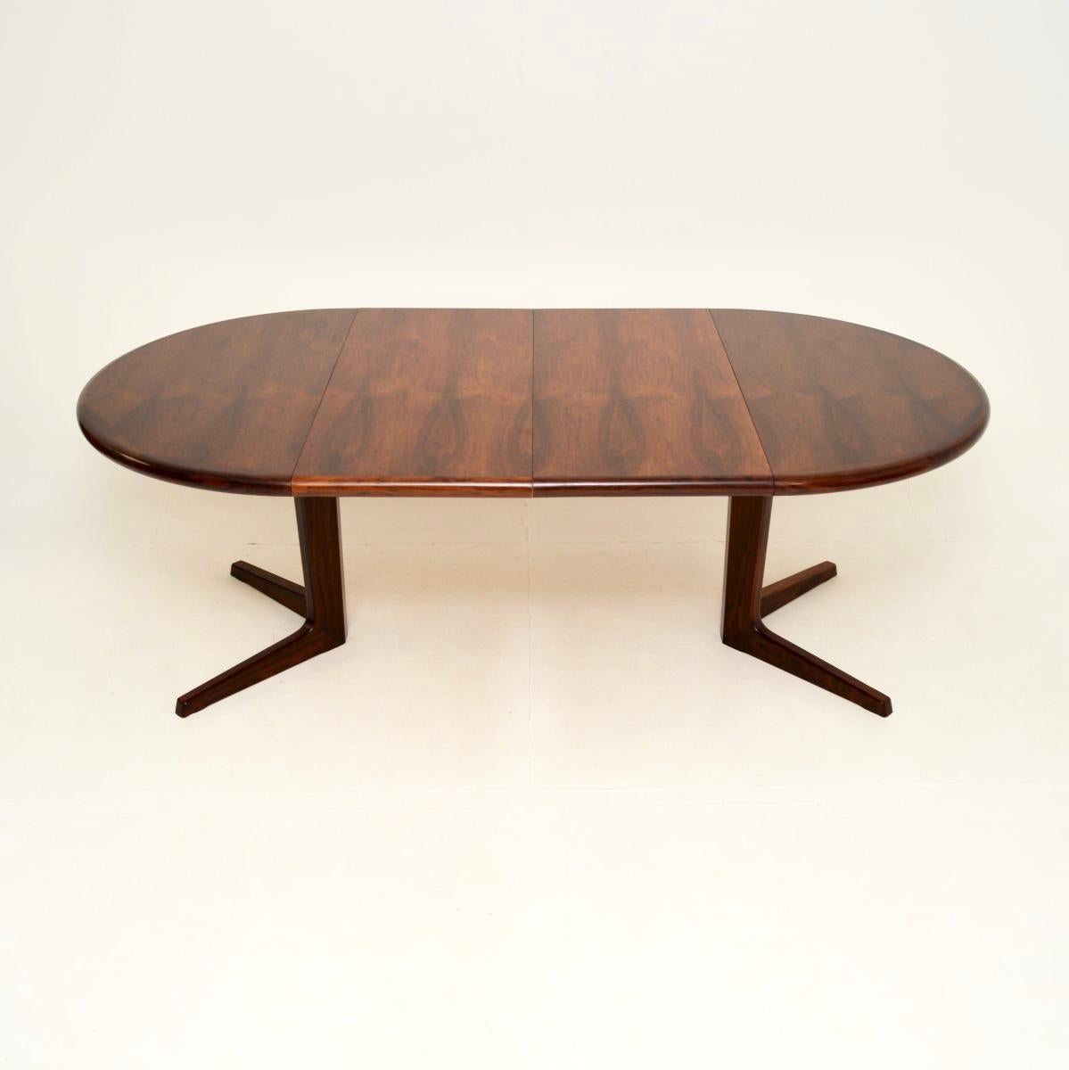 A stunning and top quality Danish vintage extending dining table, made in Denmark and dating from the 1960’s.

This has a beautiful colour and gorgeous grain patterns. It has two extra leaves that come with it, it extends to comfortably seat ten to