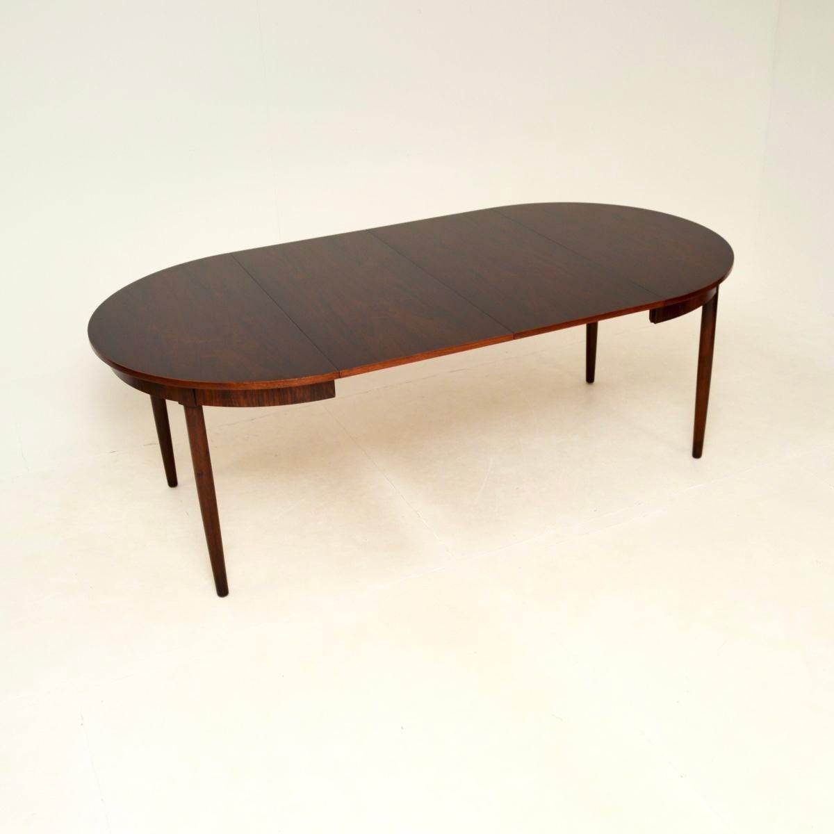 A stunning Danish vintage extending dining table, dating from the 1960’s.

The quality is outstanding, this is extremely well made and has a very practical design. The circular top opens and extends to fit either one or two leaves, to seat eight