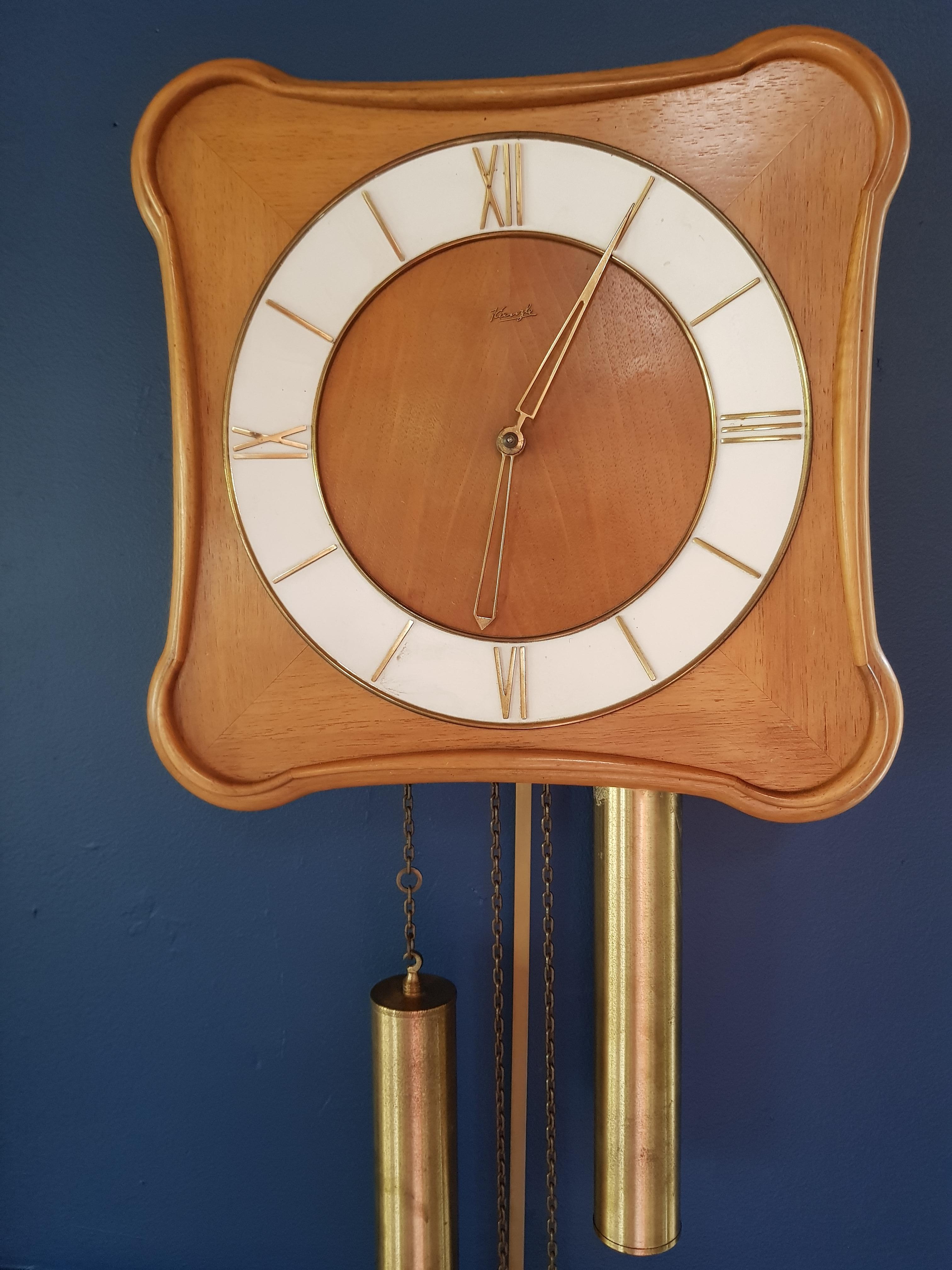 Danish vintage hanging clock by M. Christiensen & Søn, 1960s, teak wood.
 