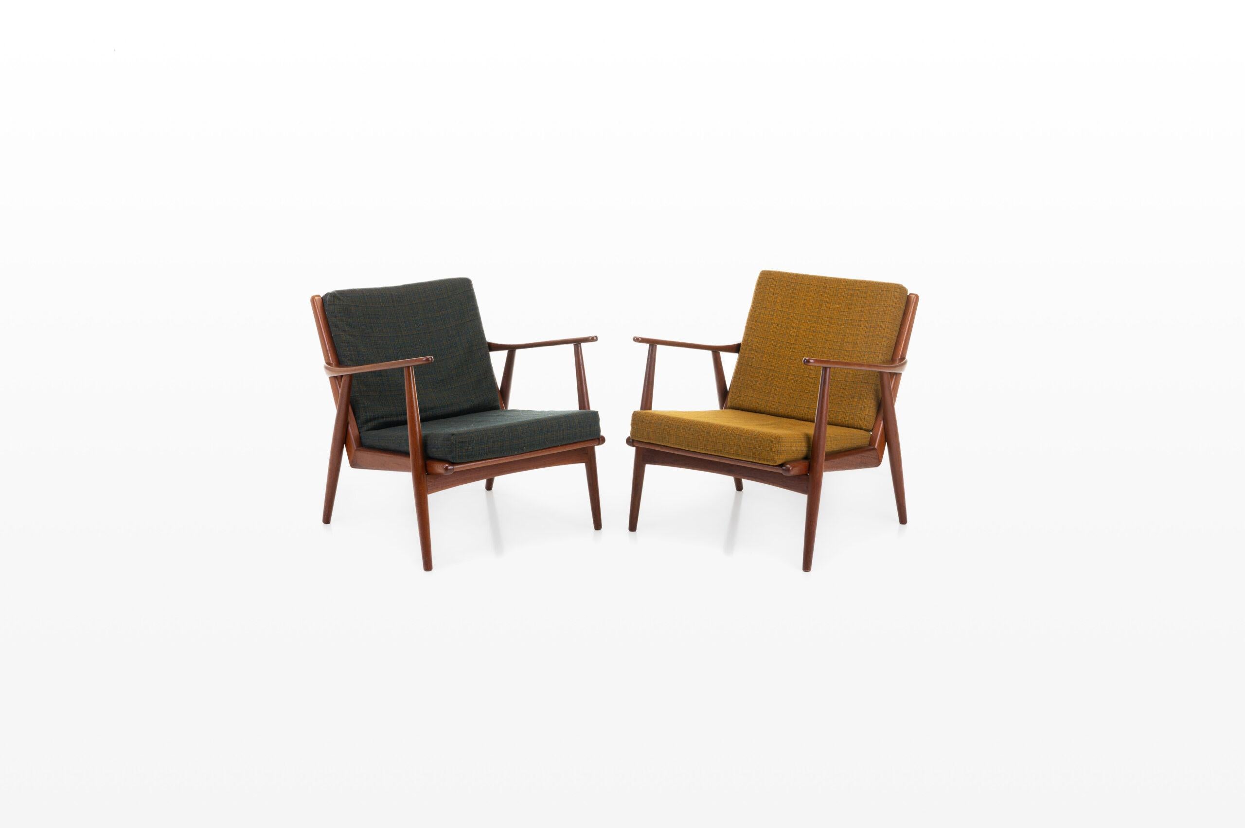 Set of two vintage easy chairs produced in Denmark. The armchairs have a teak frame and are still in very good condition.
 