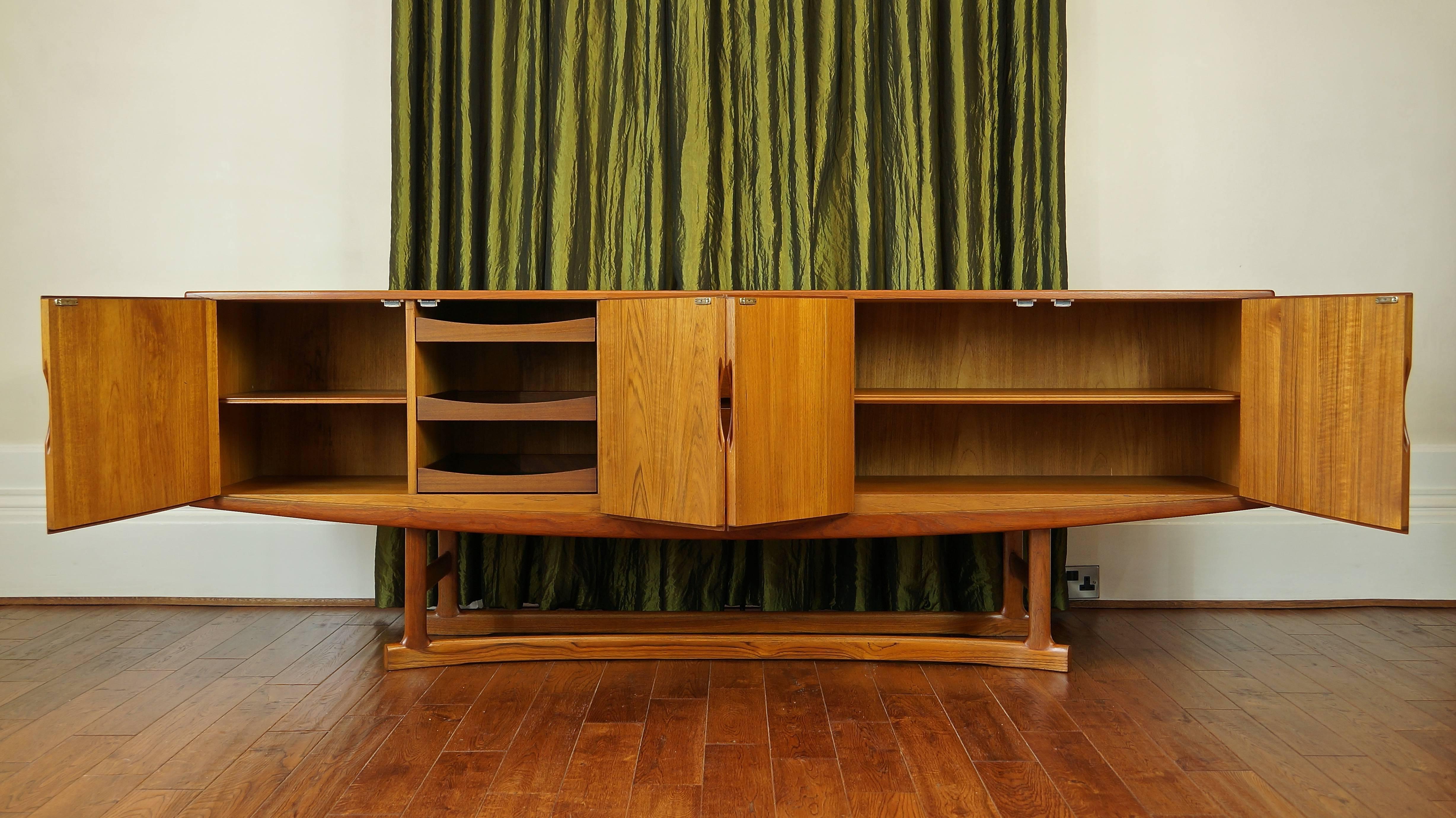 Substantial and rare vintage Danish HB20 teak sideboard or credenza.

Designer: Johannes Andersen, Denmark.

Manufactured by: Hans Bech,

circa 1968.

In our last ten years trading exclusively in fine midcentury investment pieces, this is by