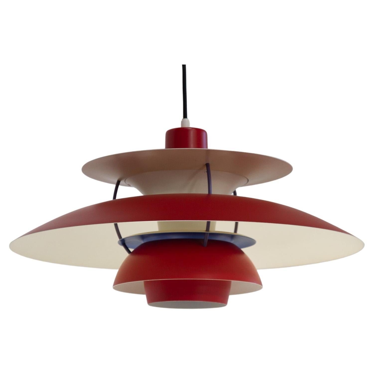 Danish Vintage red ceiling pendant PH5 by Poul Henningsen, 1960s.
Iconic Danish lighting designed in 1958 by Poul Henningsen for Louis Poulsen. This model is known as PH 5 because it has five individual shades. Emits a soft light outwards and