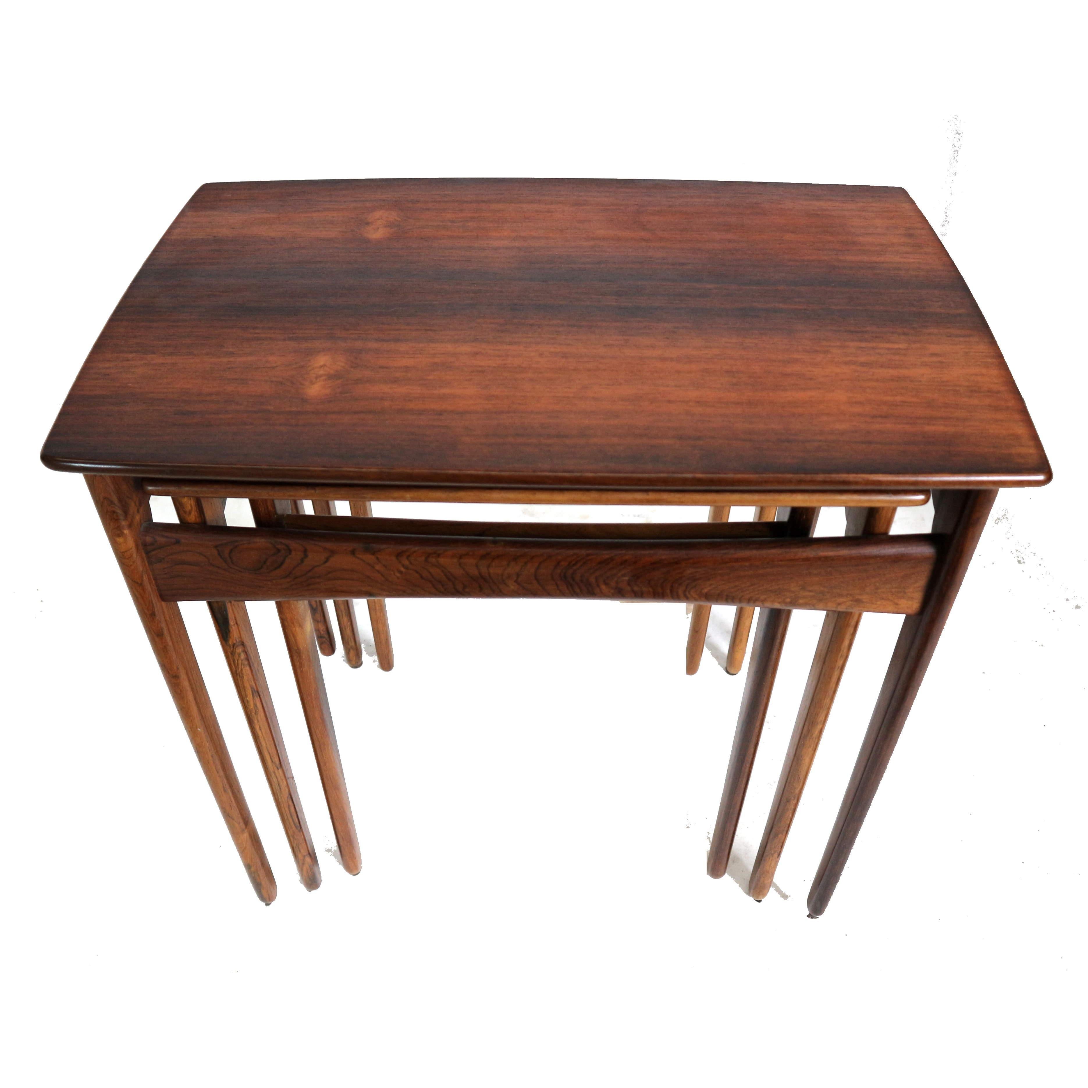 Danish vintage rosewood nesting tables / set of 3 side tables made in the 60s.

Dimensions:
Table 1: W 55 cm H 51.6 cm D 35.8 cm
Table 2: W 46 cm H 50.3 cm D 33.6 cm
Table 3: W 38.3 cm H 48.4 cm D 30.1 cm

The tables have minor traces of use. 
