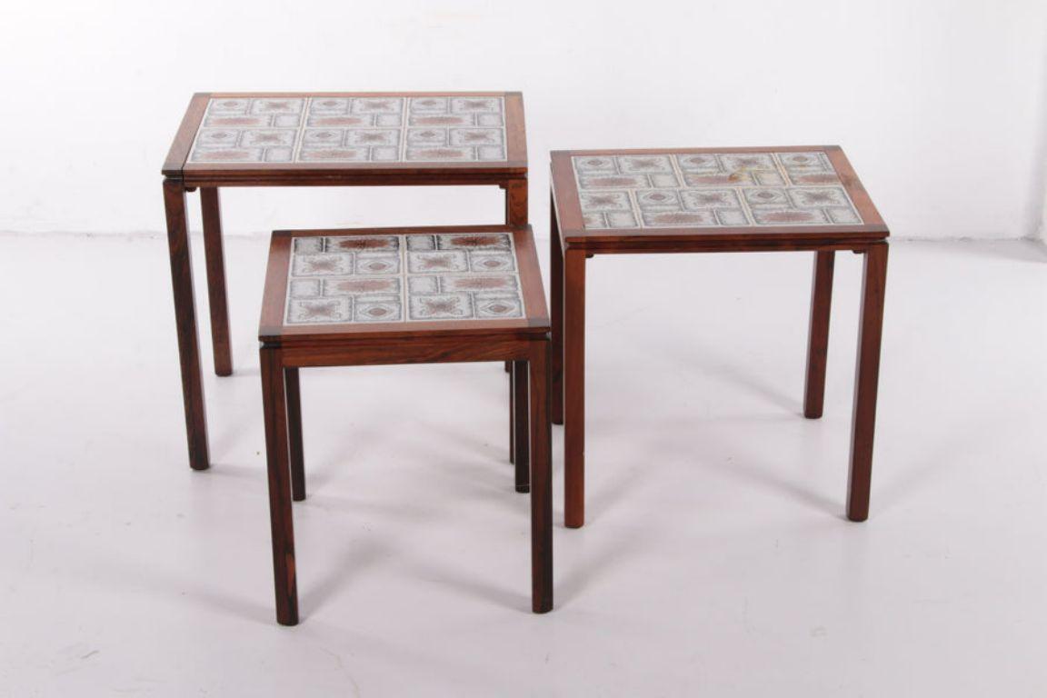 Danish Vintage Set Side Tables with Cream/Brown Tiles, 1960s

A beautiful set of three side tables that can be pushed together. 
This table set comes from Denmark and was produced around the 1960s.

The frame of the tables is made of Brack wood,