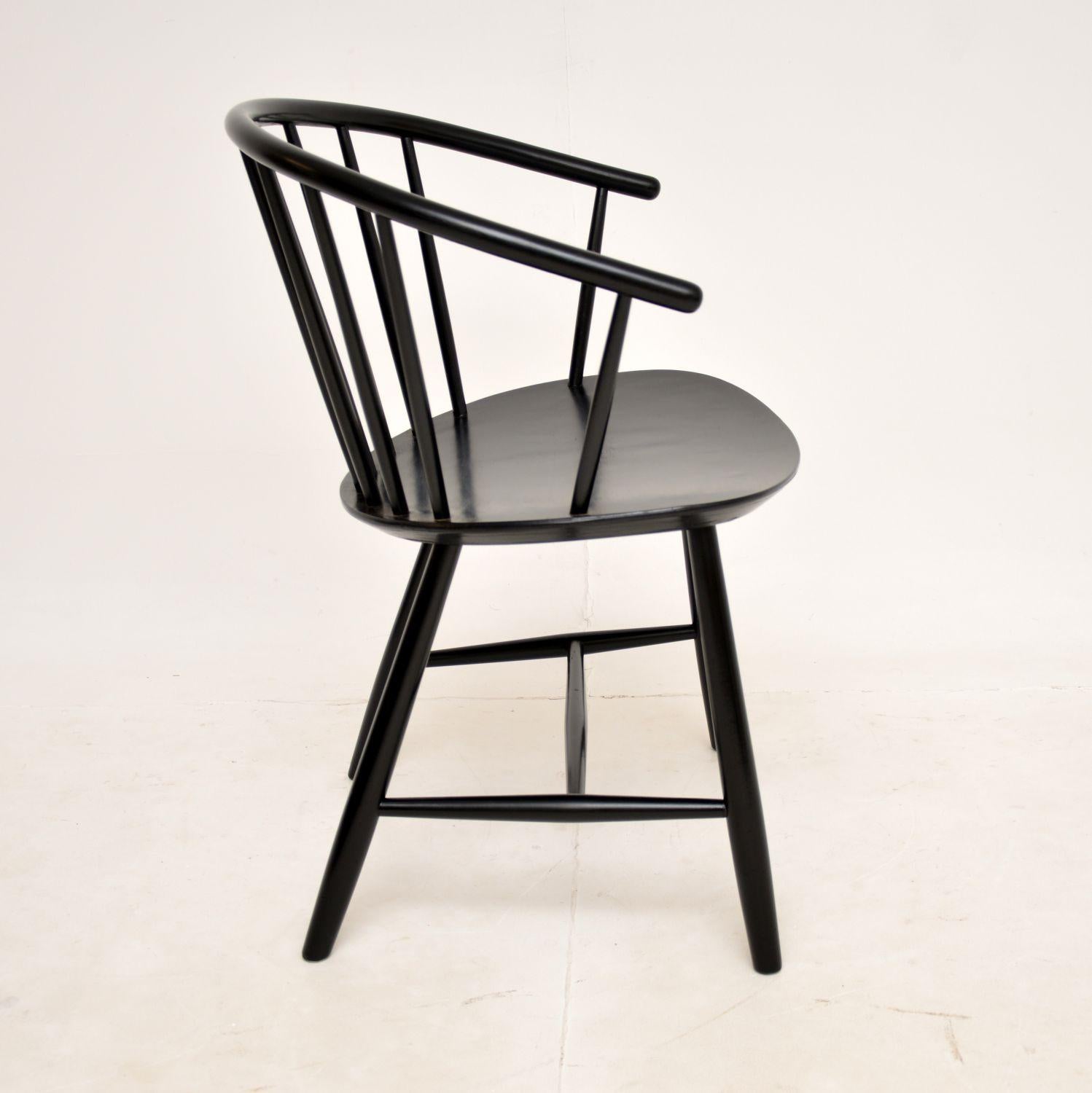 A lovely vintage ebonised armchair, made in Denmark by Fredericia and dating from around the 1970-80’s. It was designed by Ejvind Johansson.

This is of amazing quality and is a very useful size. It would be perfect in various settings as an