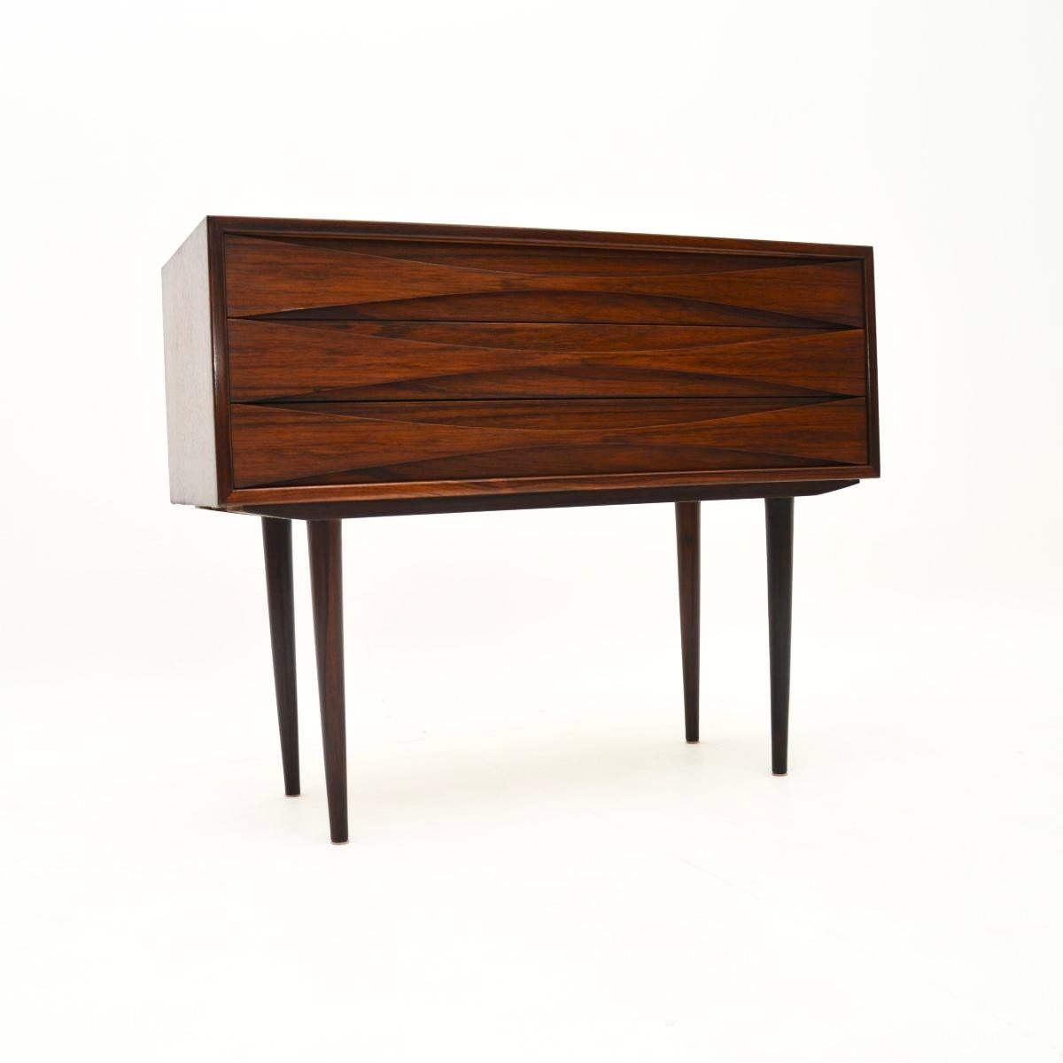 An absolutely stunning and very rare Danish vintage side table by Niels Clausen. It was made by his own company NC Mobler in Denmark, it dates from the 1960’s.

This is a very rare model with three drawers, it is hardly ever seen. The quality is