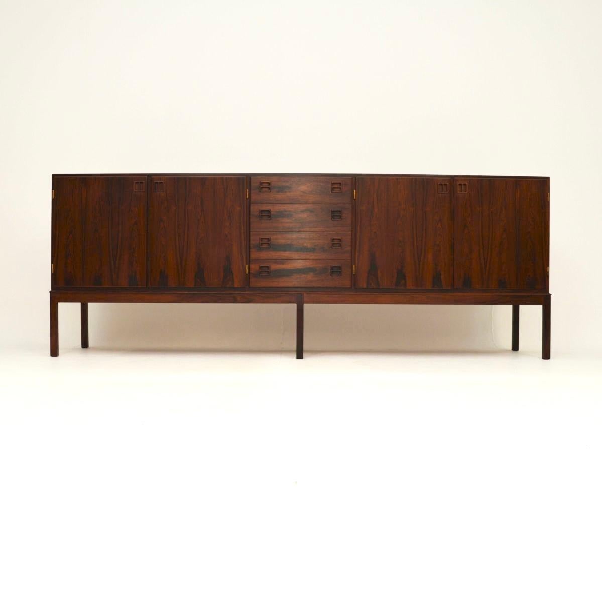 A stunning and rare Danish vintage sideboard by Johannes Andersen for Bernhard Pedersen. This was made in Denmark, it dates from the 1960’s.

The quality is outstanding, this is a large and impressive size, it is beautifully designed and looks