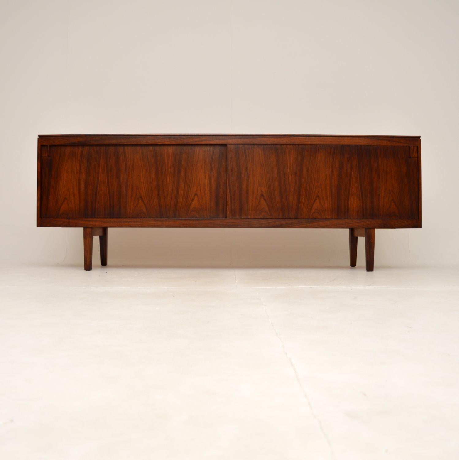 An absolutely stunning and extremely well made Danish vintage sideboard. We believe this was made in Denmark, it dates from the 1960’s.

The quality is outstanding, this is a great size and has lots of lovely features. It is low and sleek, sitting