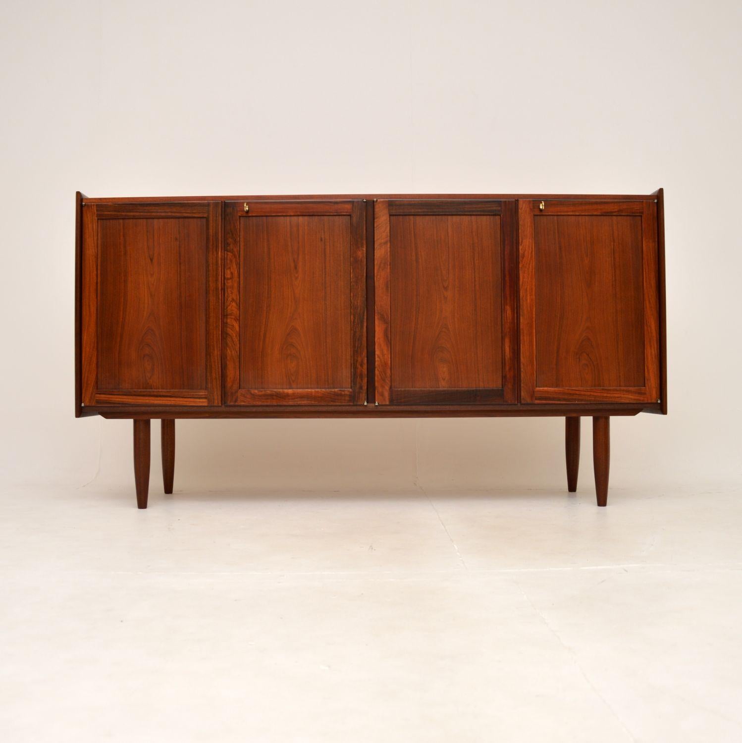 A stylish and extremely well made Danish vintage sideboard. This was made in Denmark, it dates from around the 1960’s.

It is of superb quality and is a very useful size, with lots of storage space. The colour tones and grain patterns are gorgeous,