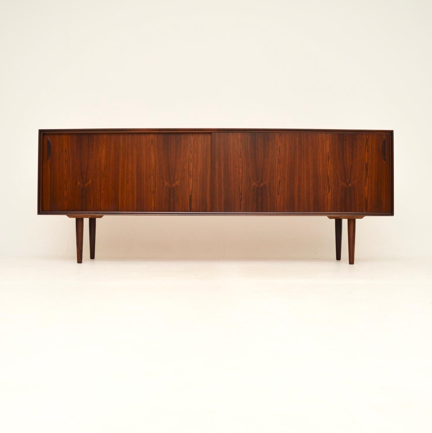 An absolutely stunning and extremely well made Danish vintage sideboard. This was made in Denmark in the 1960’s.

The quality is outstanding, this is beautifully designed with a gorgeous, sleek appearance. The colour tones and grain patterns are