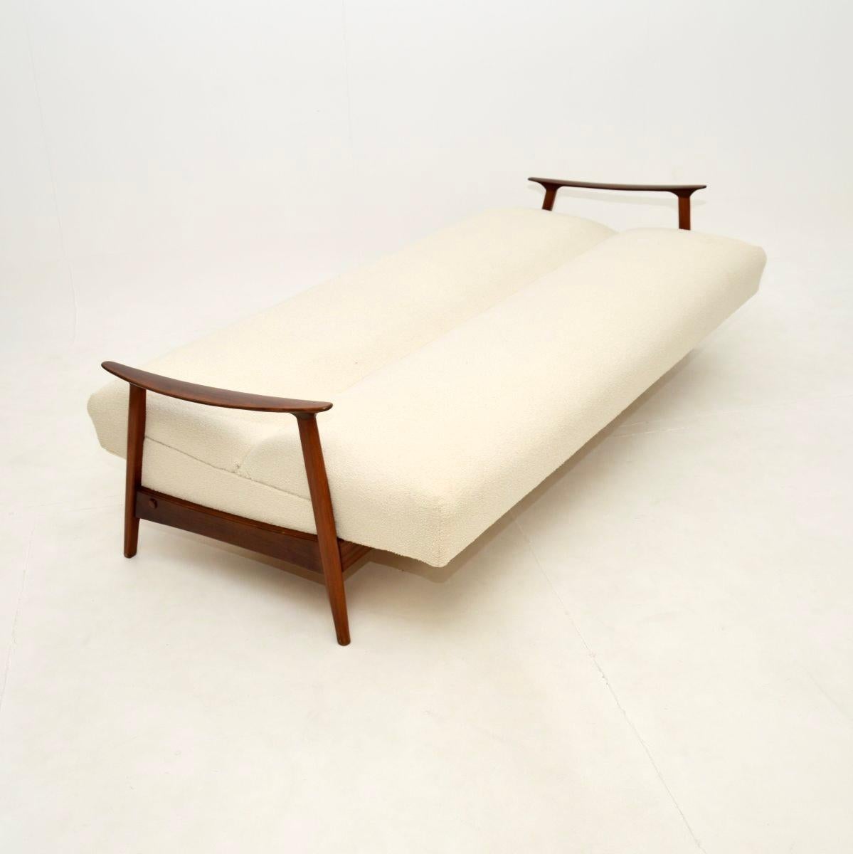 A very stylish and extremely well made Danish vintage sofa bed, dating from the 1960’s.

This is of superb quality, it has a beautifully sculpted frame. The arm rests are slender and have beautiful curves, this stands on finely tapered legs. The