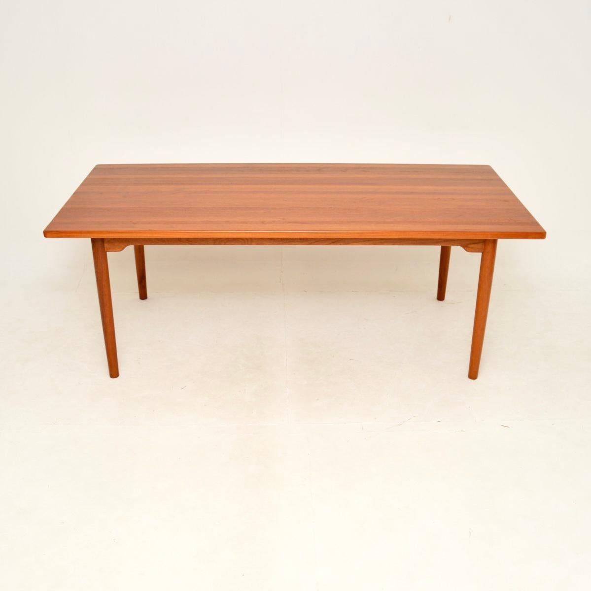 An outstanding Danish vintage solid teak dining table, dating from the 1960’s.

This is of superb quality, with completely solid teak construction and a very stylish design. It comfortable seats eight, and goes extremely well with a set of eight