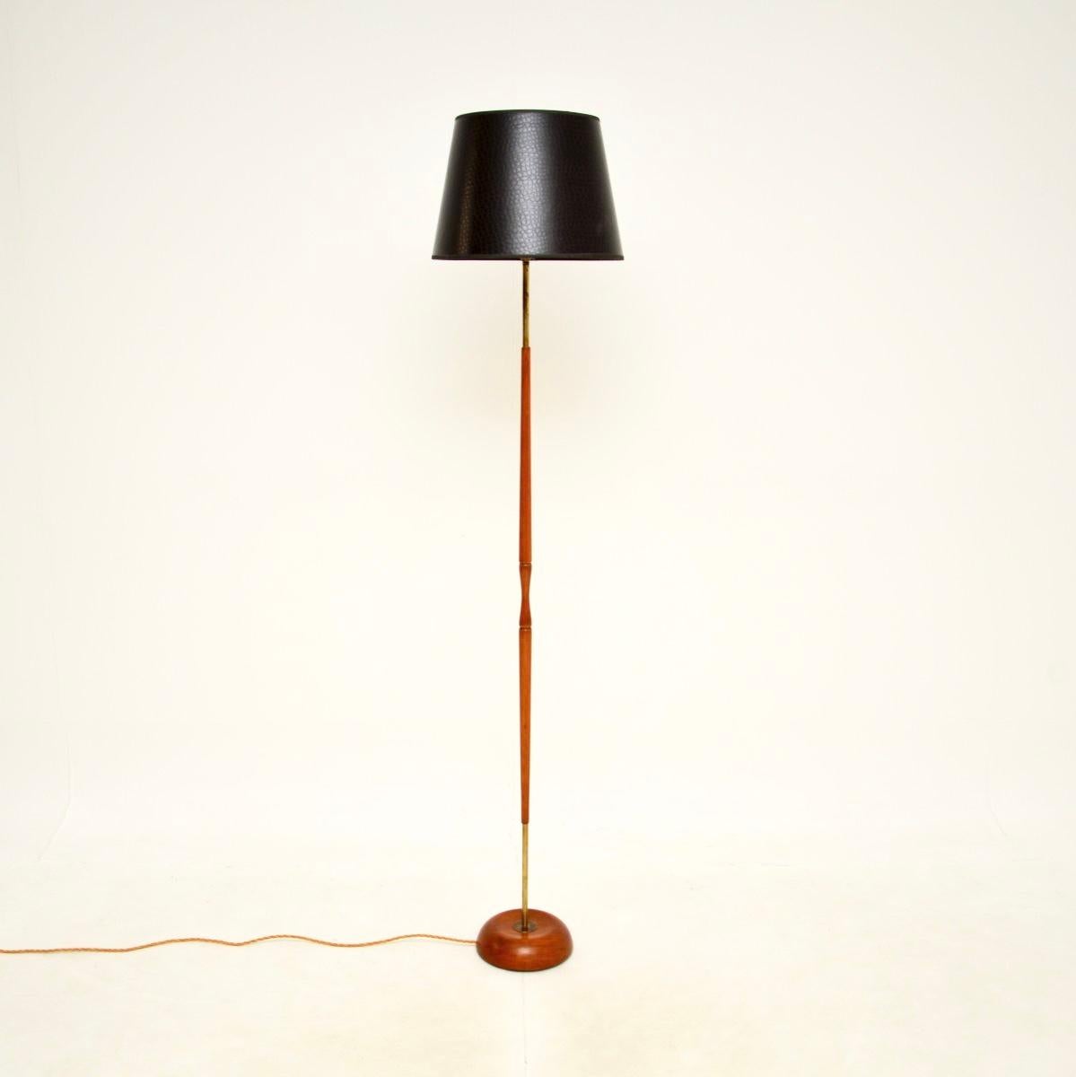 A very stylish and well made Danish vintage teak and brass floor lamp, dating from the 1960’s.

This has an amazing design, the solid teak frame has brass at the top and bottom. The base is particularly well made, with a chunky weighted design and