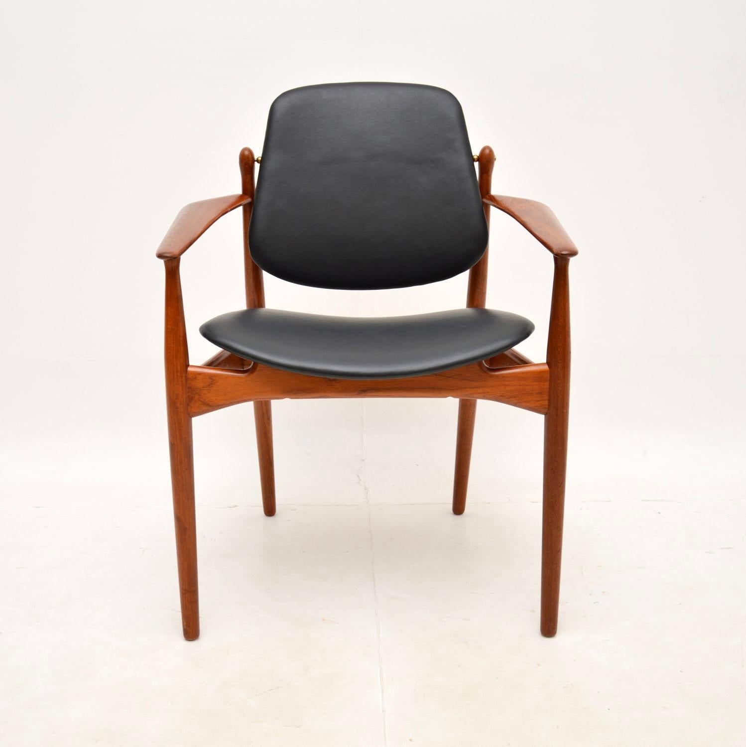 A beautiful and iconic Danish vintage teak and leather armchair by Arne Vodder. This was made in Denmark by France and Son, it dates from the 1960’s.

The quality is outstanding, this is so well made and it is extremely comfortable. It is a great